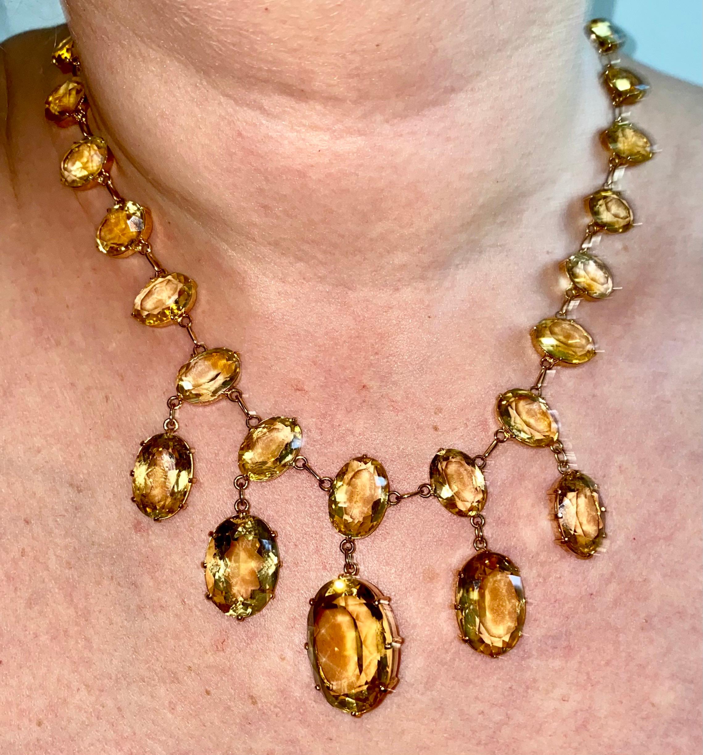 A superb quality mid Antique Riviere Necklace. This is hand crafted using Solid 15 carat yellow gold. Brilliantly Designed with 29 natural oval cut citrine stones in a claw setting. The Largest 5 graduated faceted oval lemon colour citrines are in 3