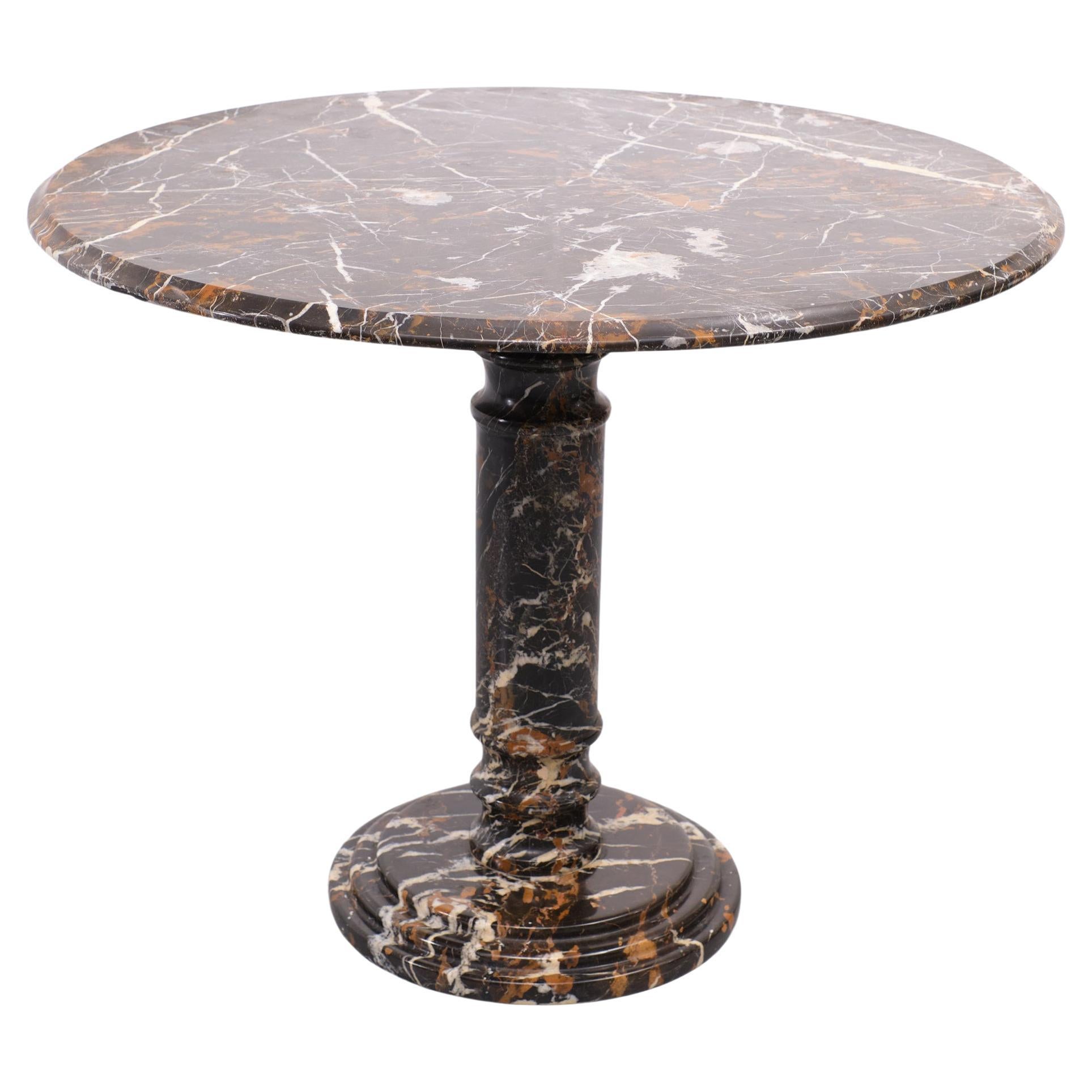 Stunning center table executed in portoro marble. So full of live and color.
Art Deco portoro marble or marmo di portovenere? It is quarried in the Gulf of La Spezia (Liguria), Italy.
The Portoro is a fine-grained, black marble with gold veining