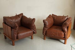 A superb brutalist pair of lounge chairs designed by Jonathan De Pas