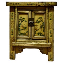 A Superb Cream Lacquered Chinoiserie Decorated Cabinet