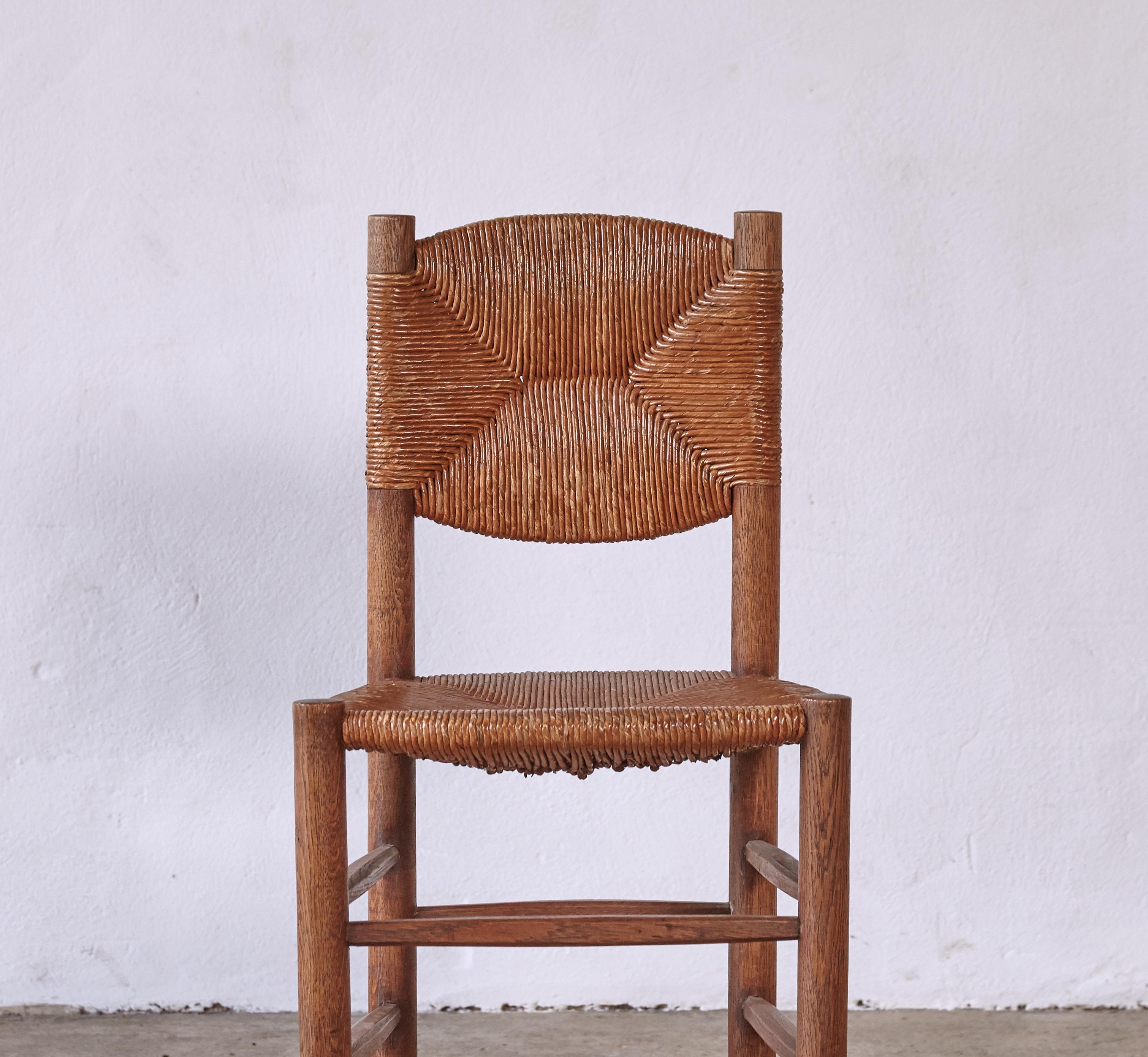 A superb Charlotte Perriand Model 19 Bauche chair, France, 1950s in original condition. Good structural condition, wonderful tone and patina, original rush with minor surface losses. Ready to use, a really nice example of this chair. 



UK