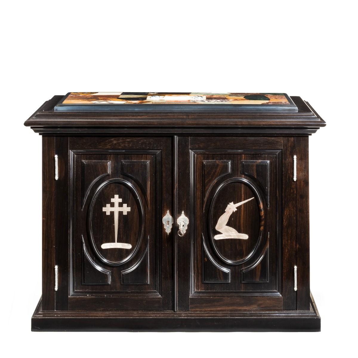 A superb early Victorian ebony collector’s cabinet, of rectangular form with two cupboard doors opening to reveal four short and two long drawers lined in the original silk velvet, the top inset with a pietra dura panel of British hardstones and