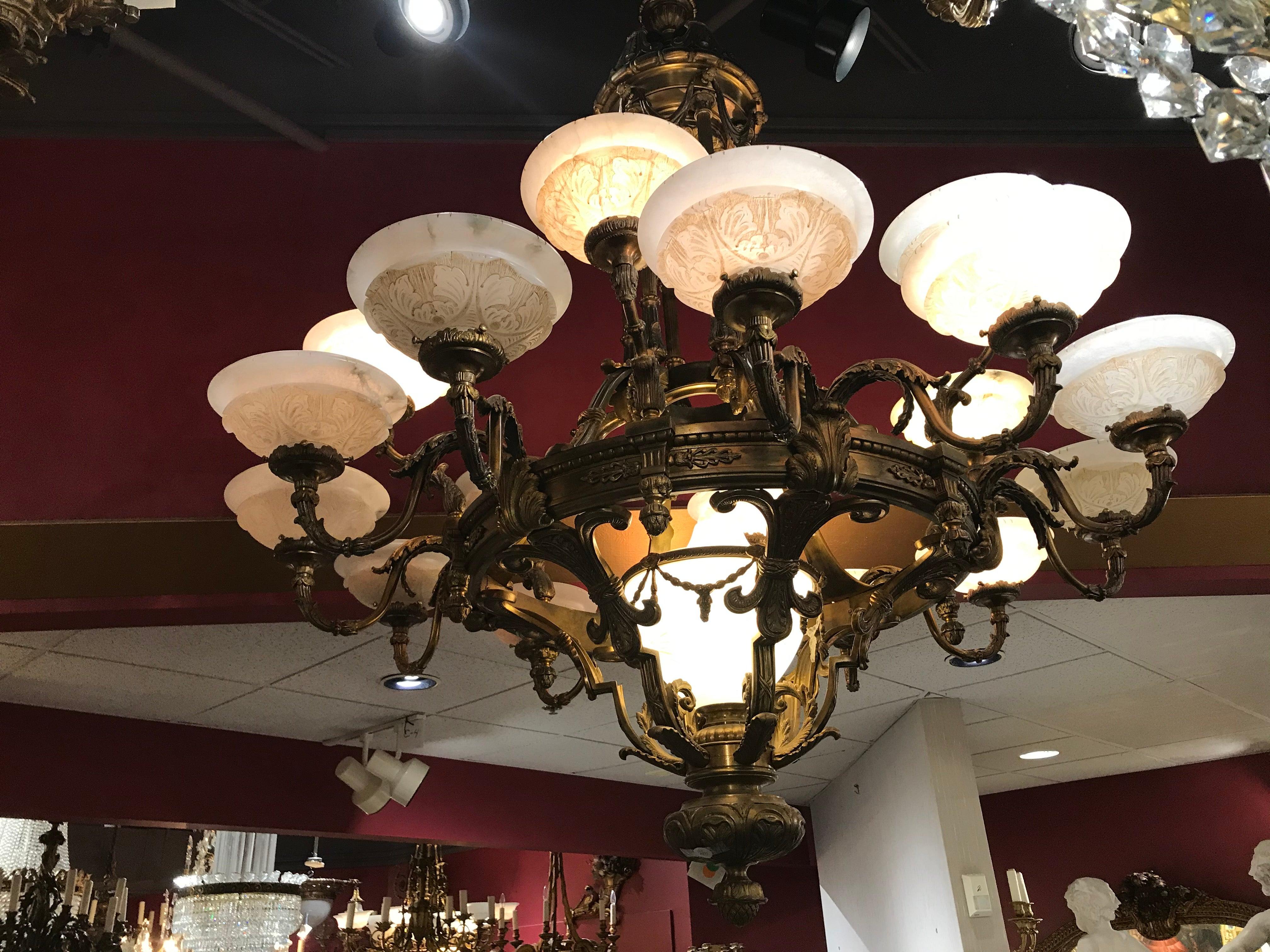 A magnificent gilt bronze chandelier with hand carved alabaster shades and dome.
France, circa 1920. 9 lights
Dimensions: Height 77