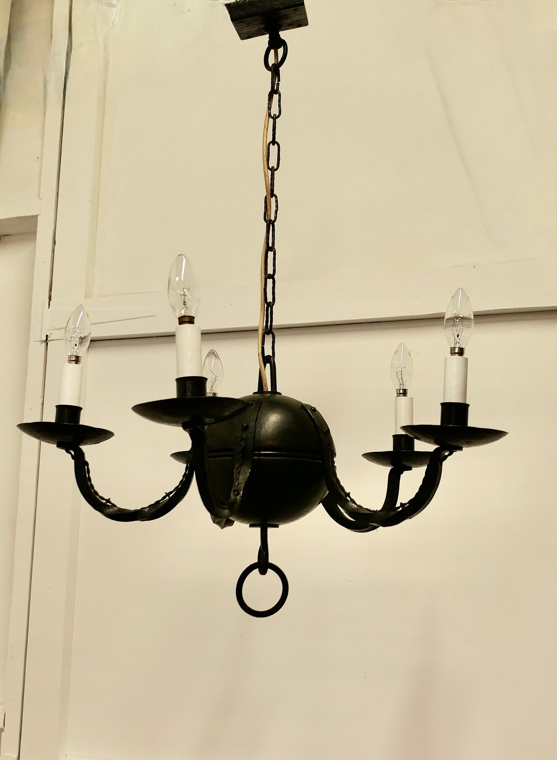 A Superb Gothic Iron and Wood Chandelier

A very handsome piece, Large Heavy and very Gothic in design, the light
has 5 wide branches and would enhance the entrance of any Gothic Doorway or light the Hallway of a Castle  

The Light is sound and