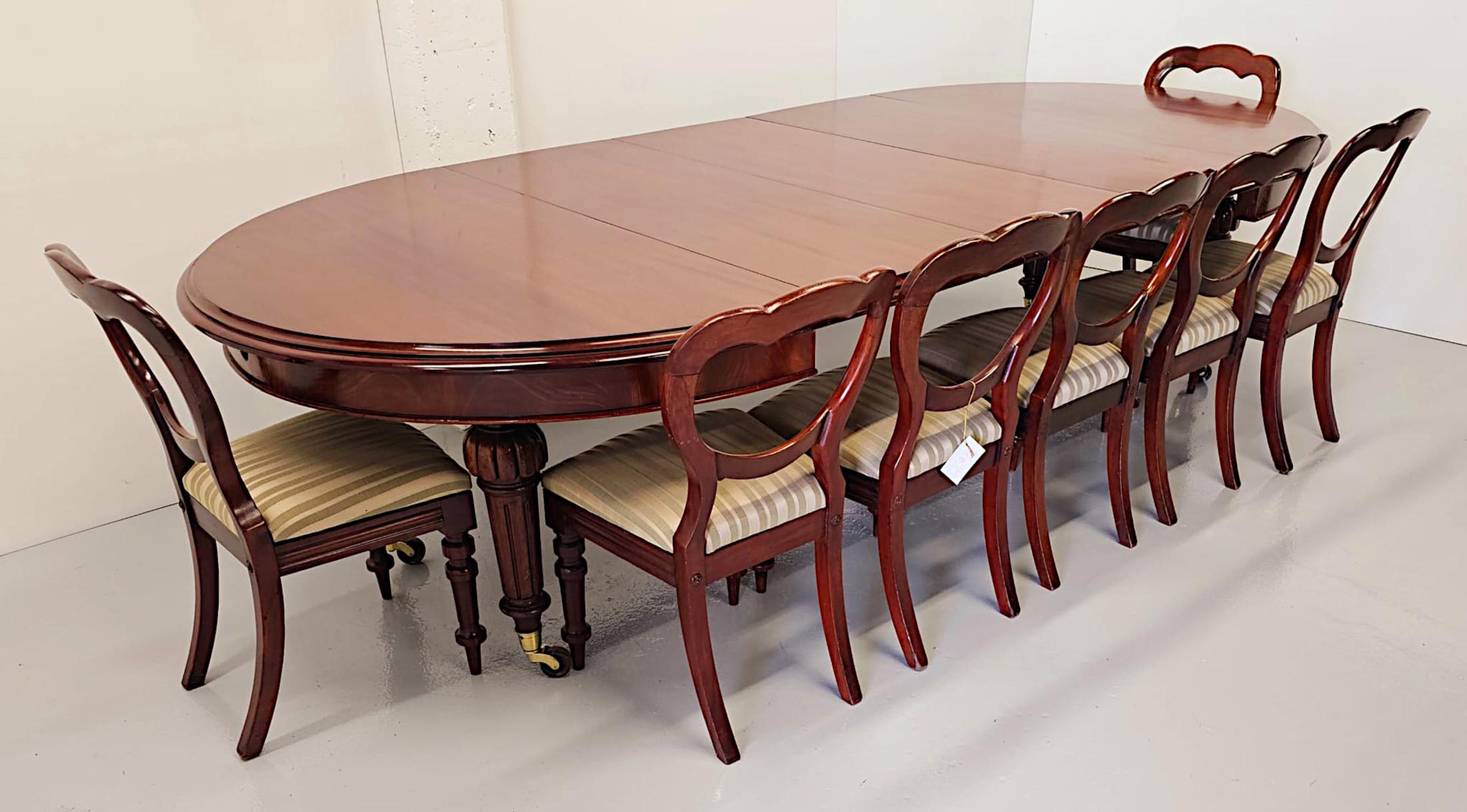 A superb 19th Century mahogany D-end extendable dining table of impressive proportions, finely hand carved and of exceptional quality.  This fine piece is fully restored with beautifully rich patination and grain and features three interchangeable