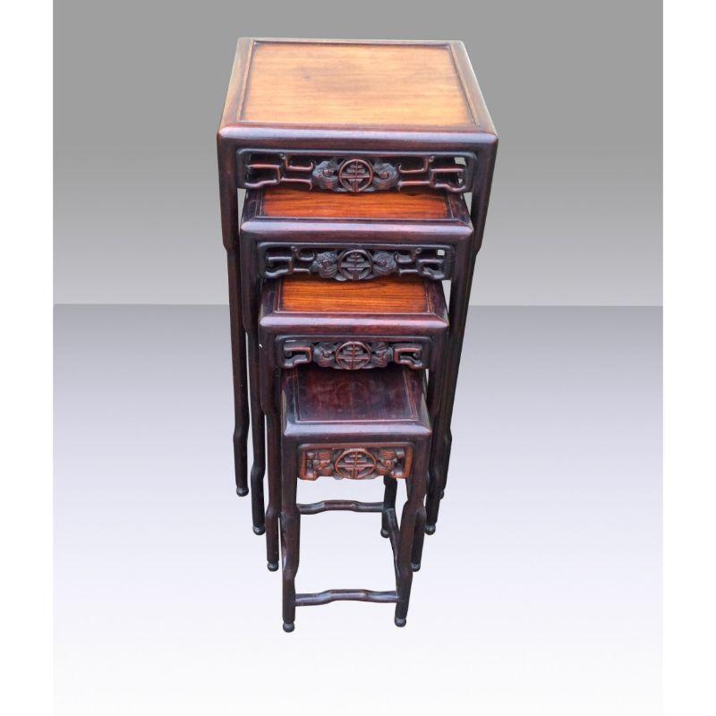A decorative nest of Chinese cherry wood occasional tables. Huang Hua Li, each with foliate carved and pierced frieze In Superb Condition [No Loose Joints]

15ins x 15ins x 28.5ins
Circa 1890

Declaration: This item is antique. The date of