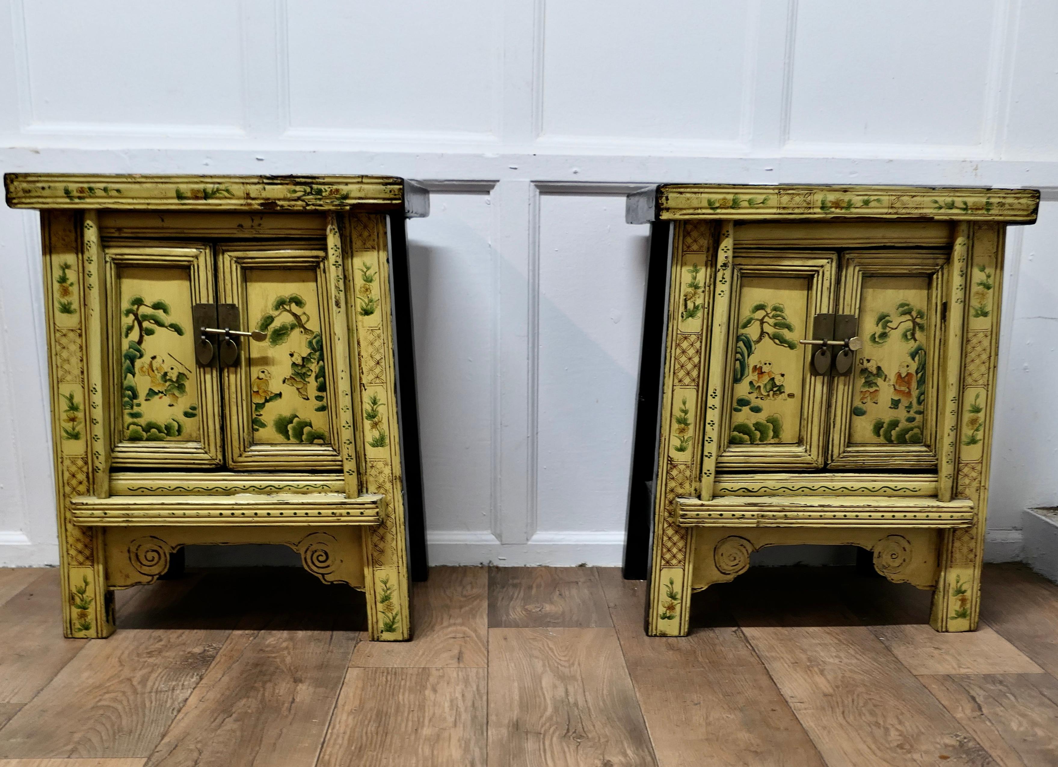 A Superb Pair of Cream Lacquered Chinoiserie Decorated Cabinets. 

A Prime example of chinoiserie decor with traditional Chinese illustrations on the front panelled doors and a simple Pin Lock on each
Inside, they each have a removable shelf, both