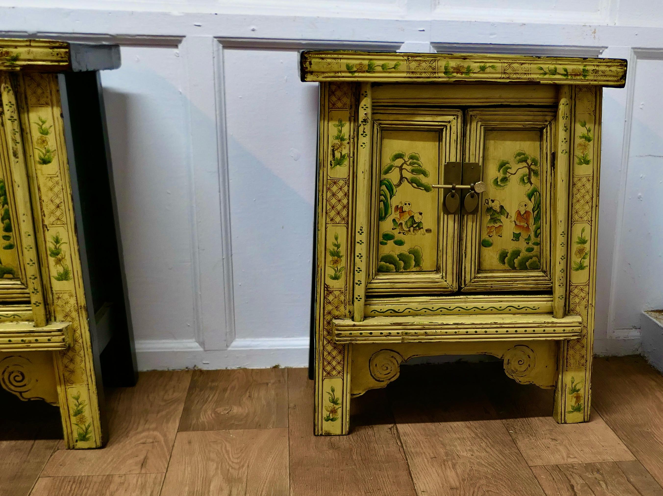 Late 19th Century A Superb Pair of Cream Lacquered Chinoiserie Decorated Cabinets.     For Sale