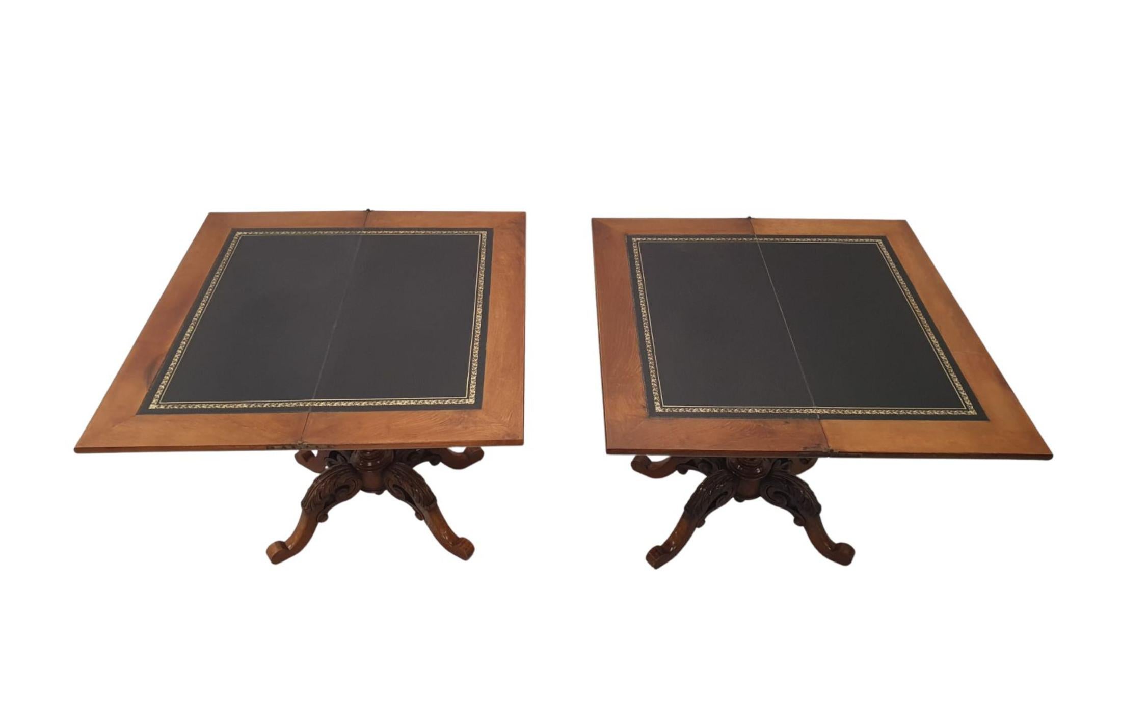 A superb pair of early 20th Century richly patinated walnut turn over leaf card tables of gorgeous quality with rich patination and grain. The hinged and moulded top of rectangular form folding over to reveal fitted gilt embossed tooled leather