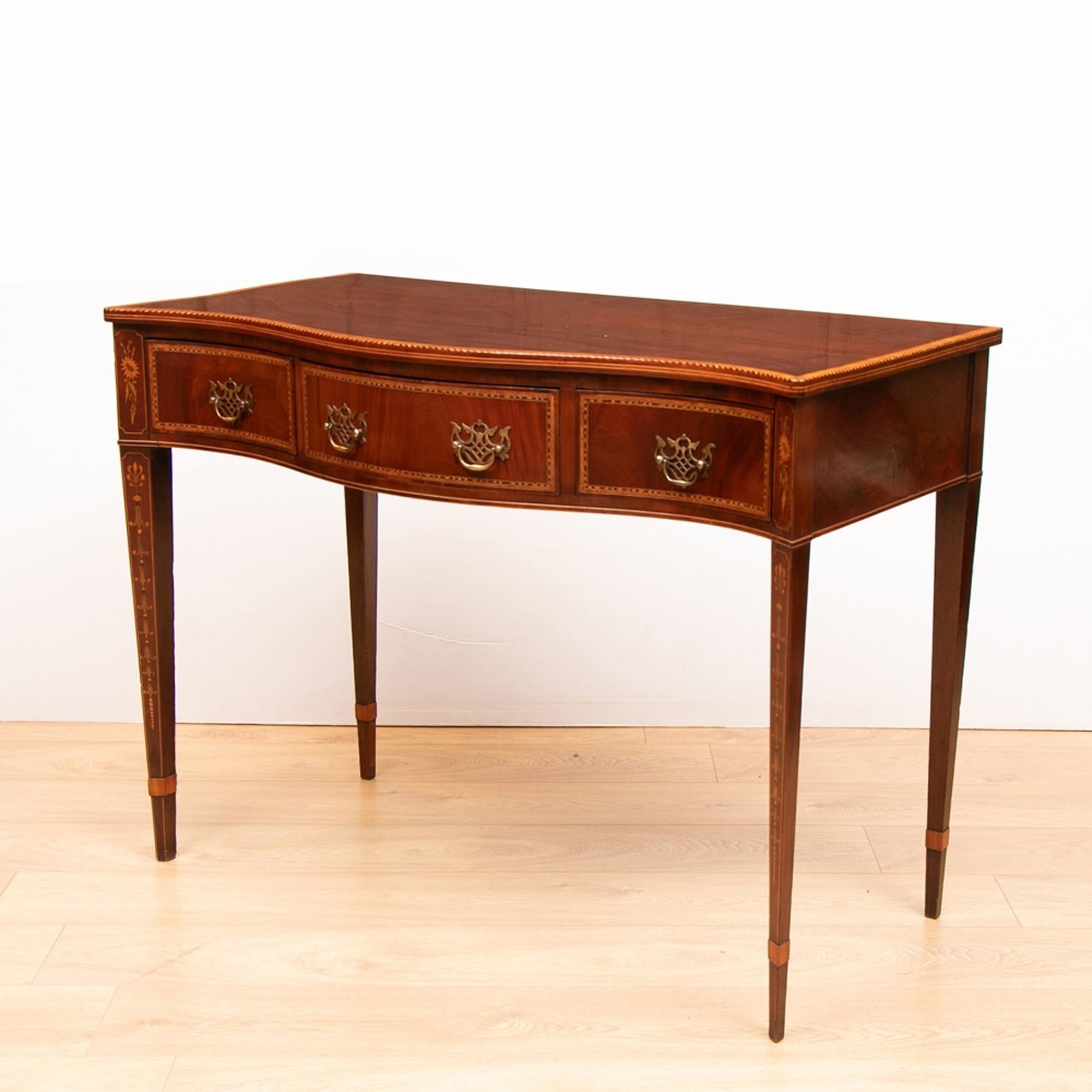 A superb quality Sheraton revival, satinwood and box wood inlaid cross banded consul table. Excellent quality solid mahogany timbers and lovely detailing including the canted inlaid tapering legs. A high quality Victorian copy which looks and stands