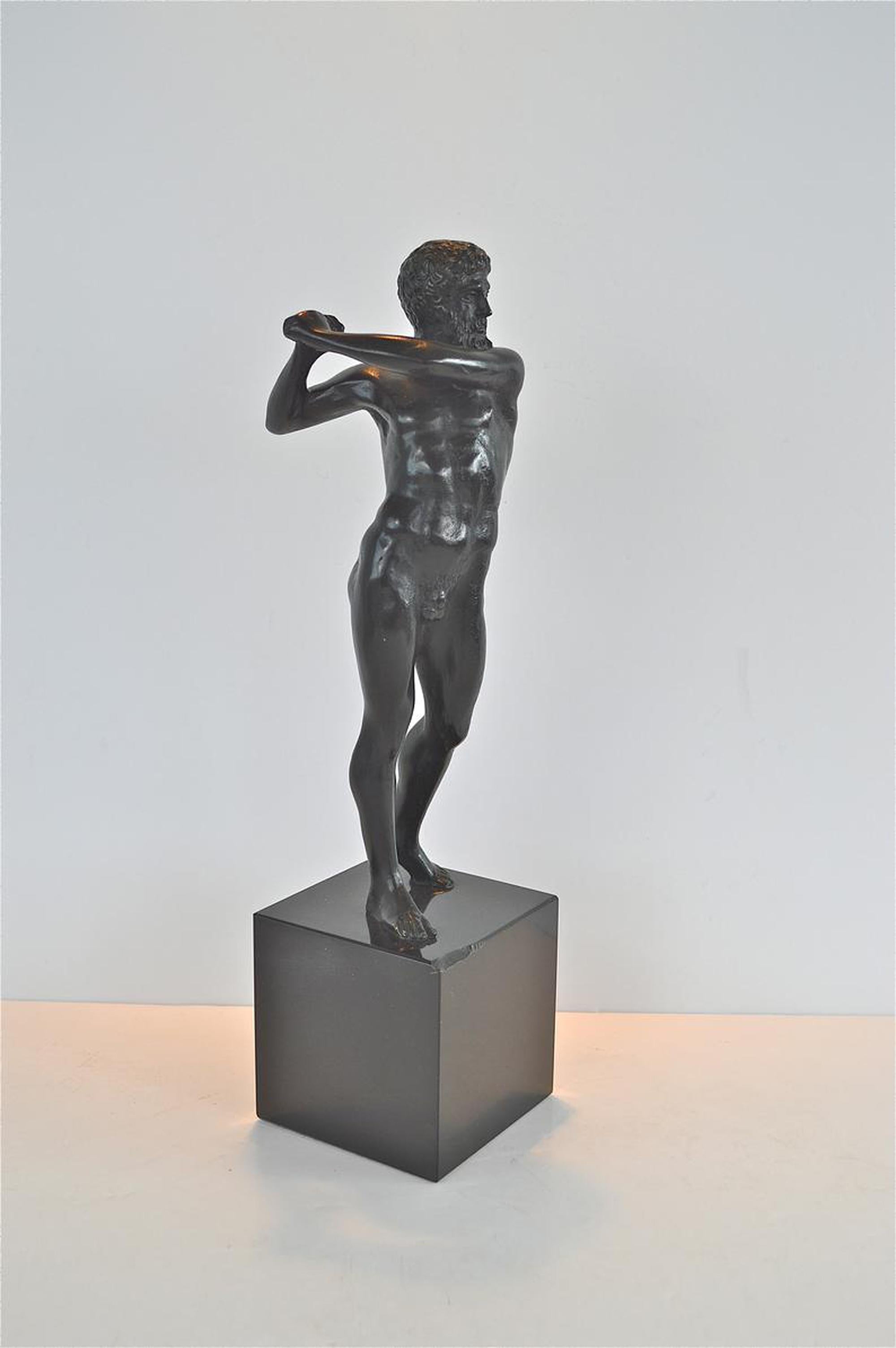 A superb quality statue of a classical Greek man. Cast in bronze and standing on a black marble base. I am unsure of the age as I can't find anything on the net about these pieces. It bears a stamp on the underside of base. In good condition with a