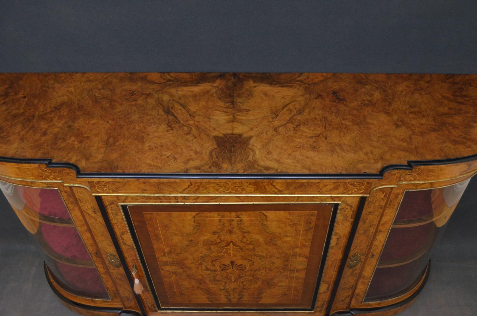 Sn4586 a superb quality and very impressive, Victorian burr and figured walnut credenza, having ebonized edge to top above finely inlaid frieze with gilt metal decoration, paneled cupboard door with marquetry inlay enclosing shelf, flanked by