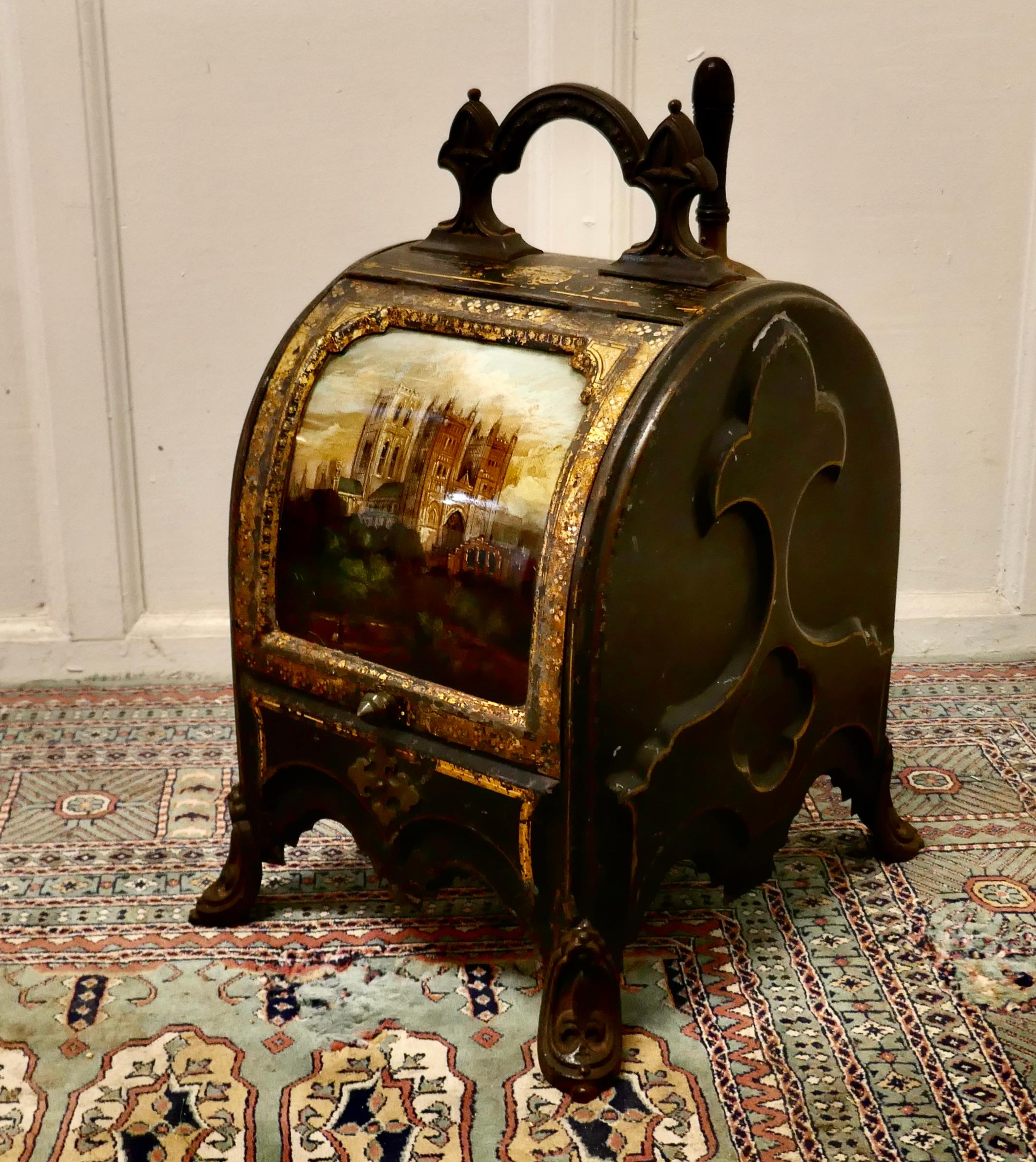 A superb regency toleware gilt and reverse painted purdonium

A truly stunning piece, this unusually shaped Coal Box has a study of a cathedral reverse painted on curved glass as the front piece, this method of painting is known as Verre