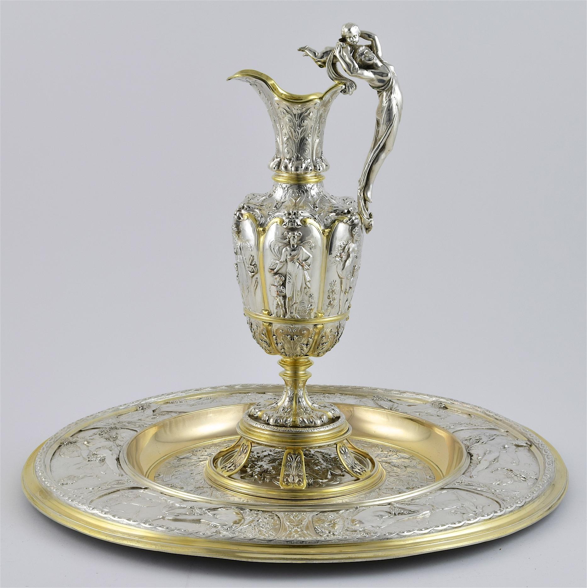 A parcel gilt silver plated electroform rosewater dish, ewer and stand, made in Birmingham. The rosewater dish is formed as 'the seasons dish', the matching jug and stand are also similarly styled with classical themes and decorations. 



Elkington