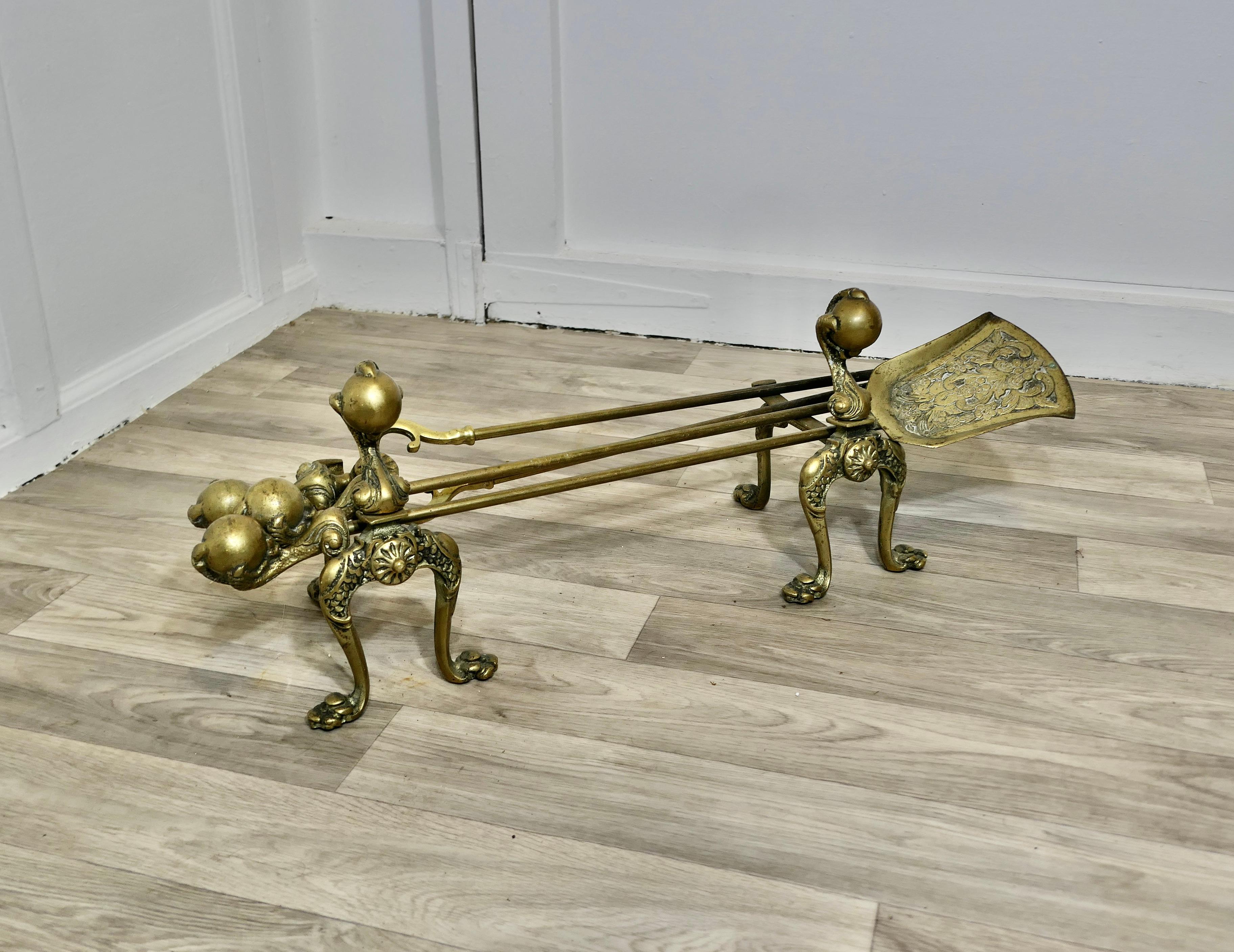A Superb Set of Arts and Crafts Gothic Fireside Tools

This is a long handled set on its own pair of matching andirons, there is a shovel, tongs, and poker, the handles have a gothic Arts and Crafts Ball and claw design
A superb quality set in very