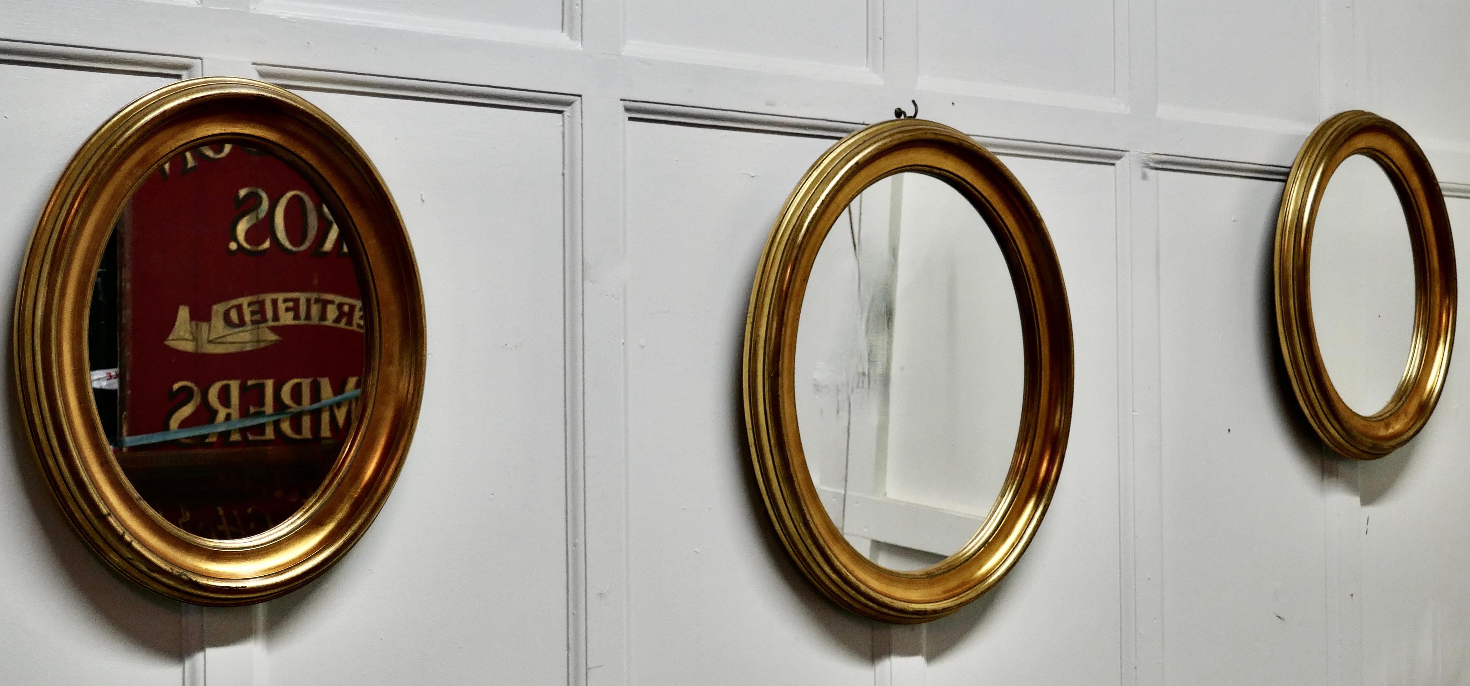 A Superb Trio of French Oval Giltwood  Mirrors

Three mirrors, 2 are 20” high x 16” wide and the other is 24” high x 20” wide otherwise identical
The mirrors have a 3” wide moulded oval Gilt frame 
The old Oval frames are all in in very good