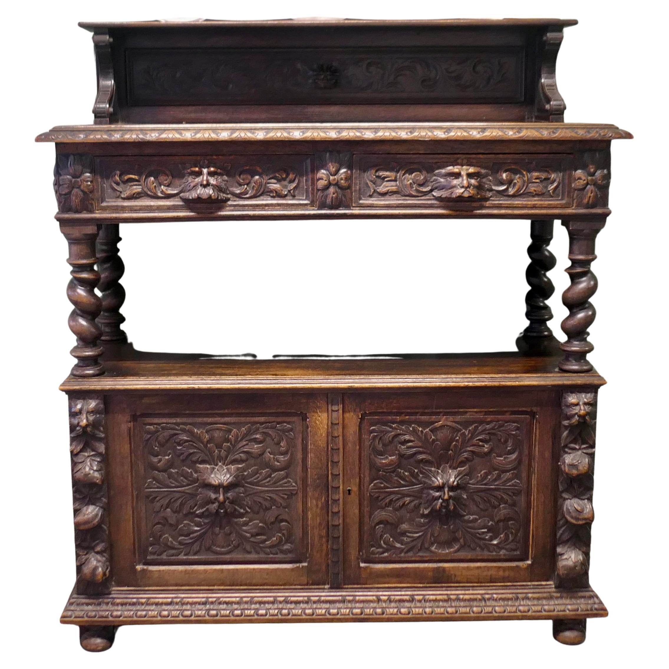 A Superbly Carved Green Man Oak Side Board or Buffet