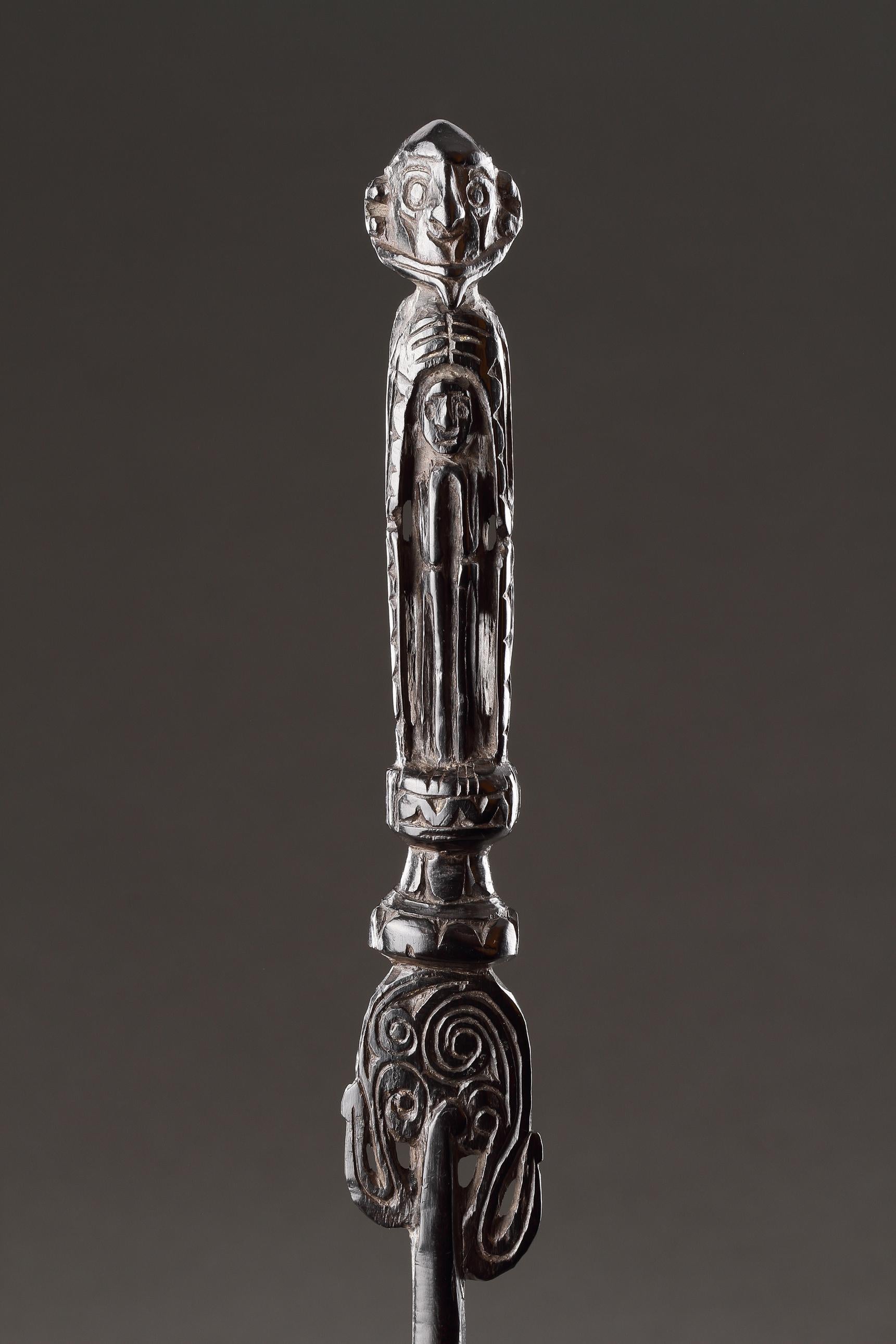 A Superbly Carved Lime Spatula Representing Two Figures
Wood (ebony) 
Northern (?) Massim, New Guinea 
19th Century 

Size: 31cm long - 12¼ ins long 

Provenance: 
Ex Anthony Meyer Gallery, Paris 
Ex Private UK collection 

Double figure spatulas