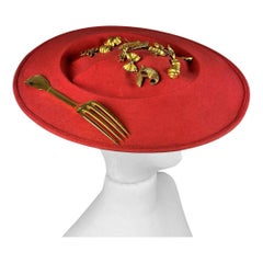 A Surrealist Hat by Isabelle Canovas in red felt and gilt bronze Circa 1980