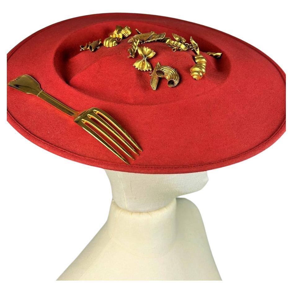 A Surrealist Hat by Isabelle Canovas in red felt and gilt bronze Circa 1980  For Sale