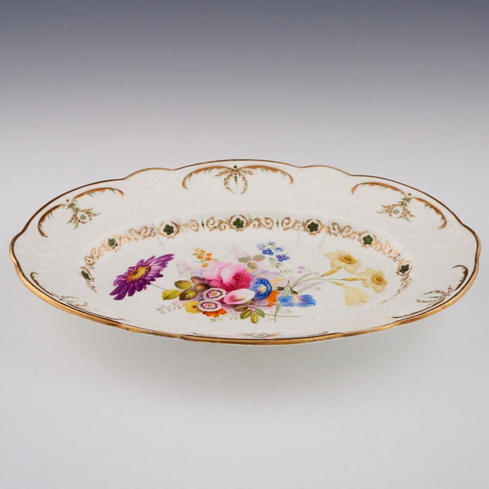 A Swansea Porcelain Oval Dish, c1820

Additional information:
Date : c1820
Period : George IV
Marks : Unmarked. Label for Leslie Joseph collection
Origin : Wales
Colour : Polychrome
Pattern : Painted with floral spray. A gilded trellis and diaper