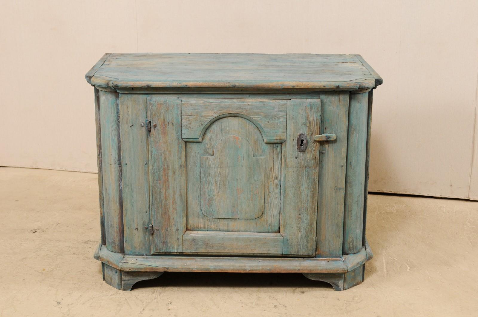 whitewashed arched wooden cabinet