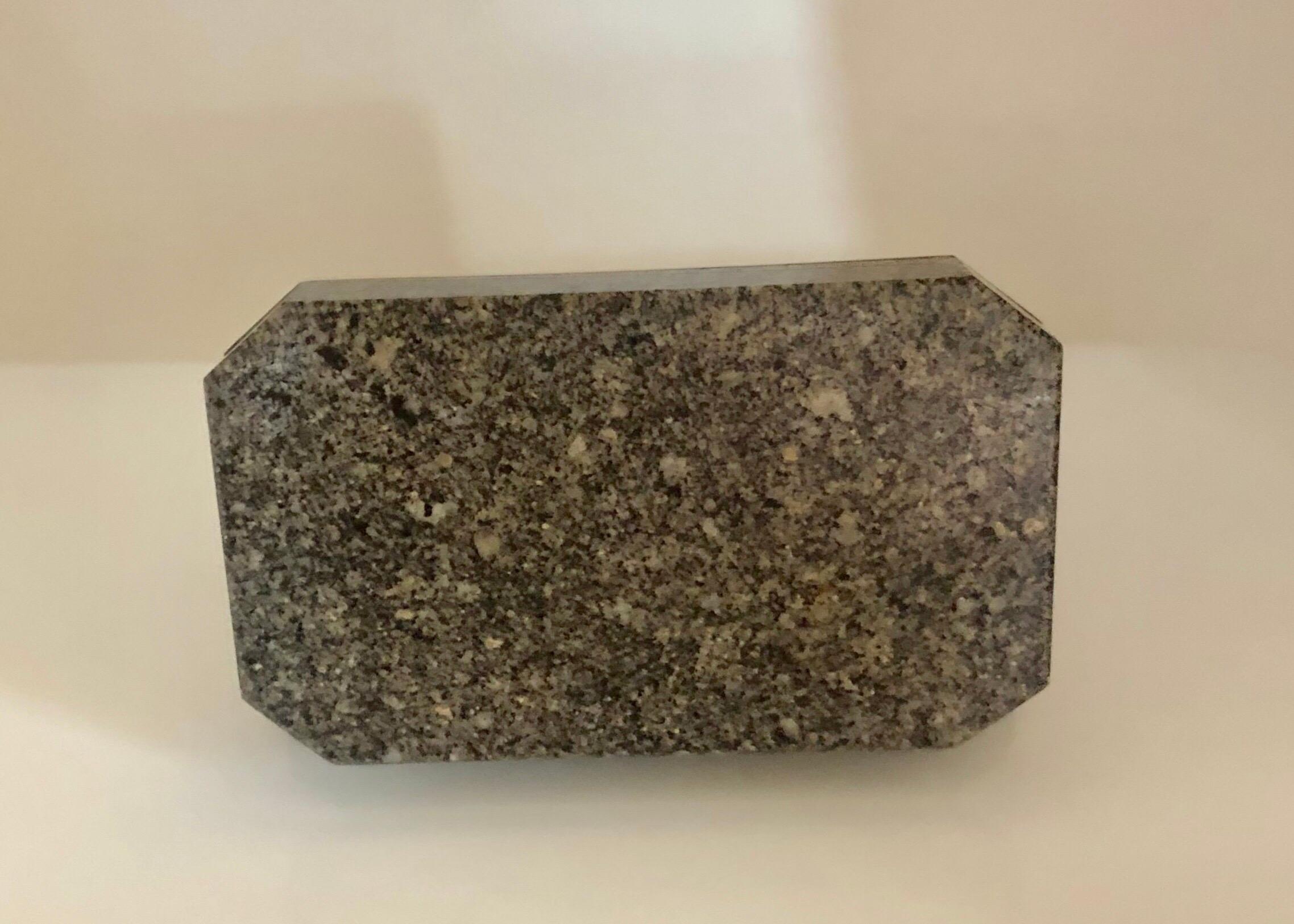 The finely carved and polished granite with tight closing hinge. 