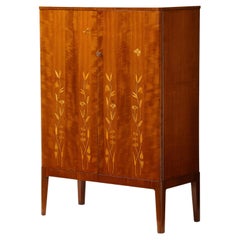 A Swedish Grace Inlaid Mahogany Cabinet, Circa 1940s