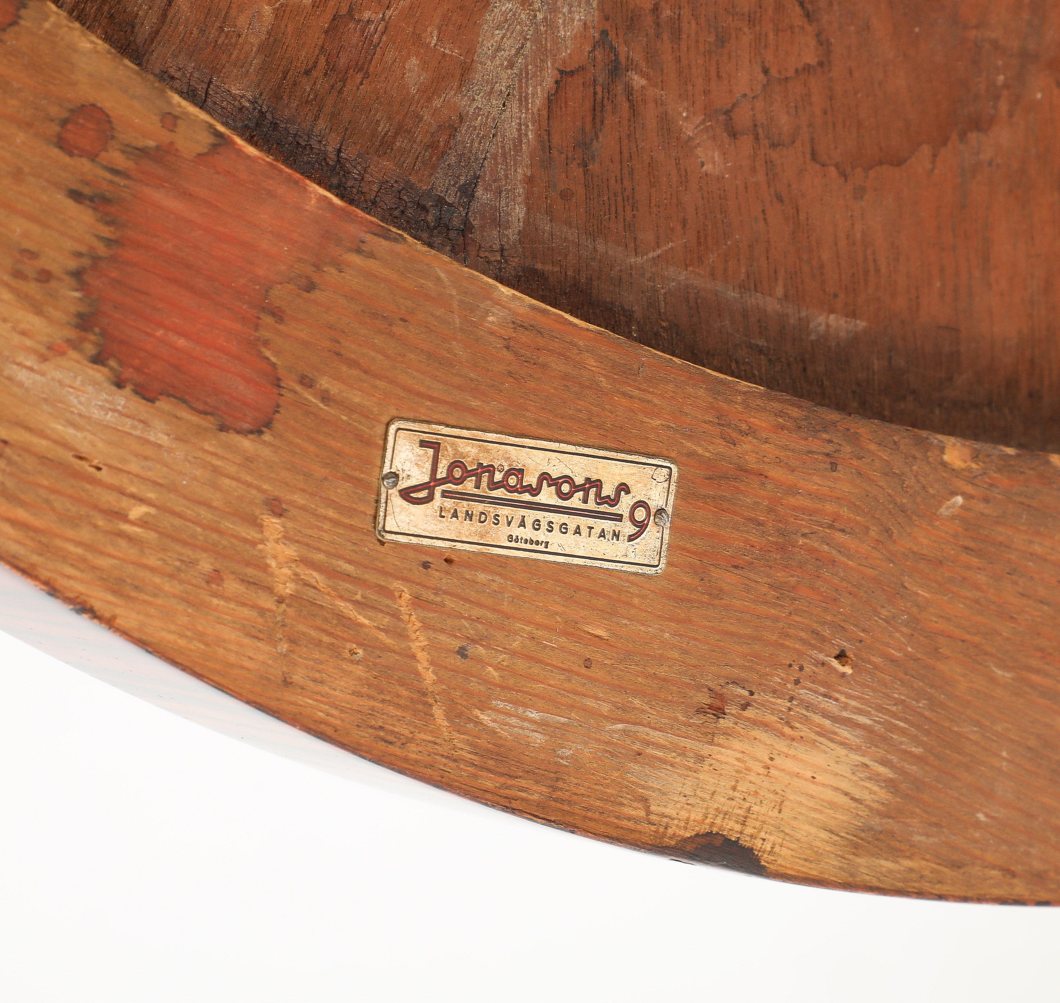 A stunning Swedish stardust inlaid side table, Circa 1930s, birch, stained birch, palisander and other wood veneers to create a starburst design. Produced by Jonasons, Landsvågsgatan, Göteborg.