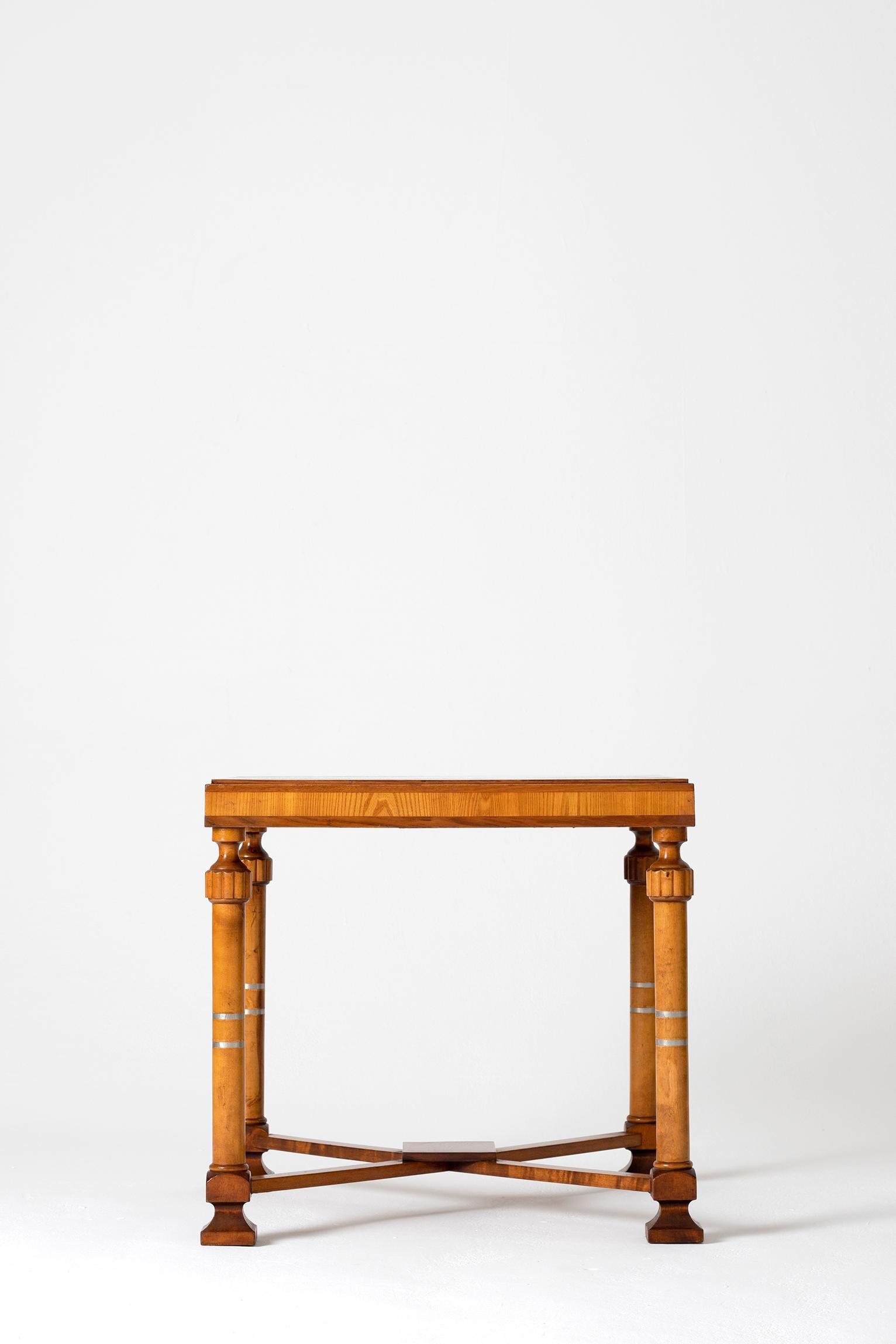 A Swedish grace birch, burr birch and ash square occasional table
Sweden, circa 1925

One of the briefest, yet among the most remarkable eras of 20th century design would have to be Sweden’s 1920s romantic national style known as Swedish Grace,