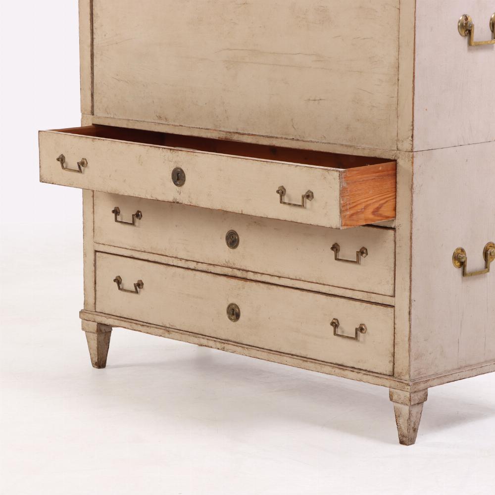 Crafted in two pieces, this Neoclassical form desk features clean lines and understated elegance, with a soft painted finish typical of the Gustavian palette. The upper section has one long drawer over a fall-front opening to reveal a fitted