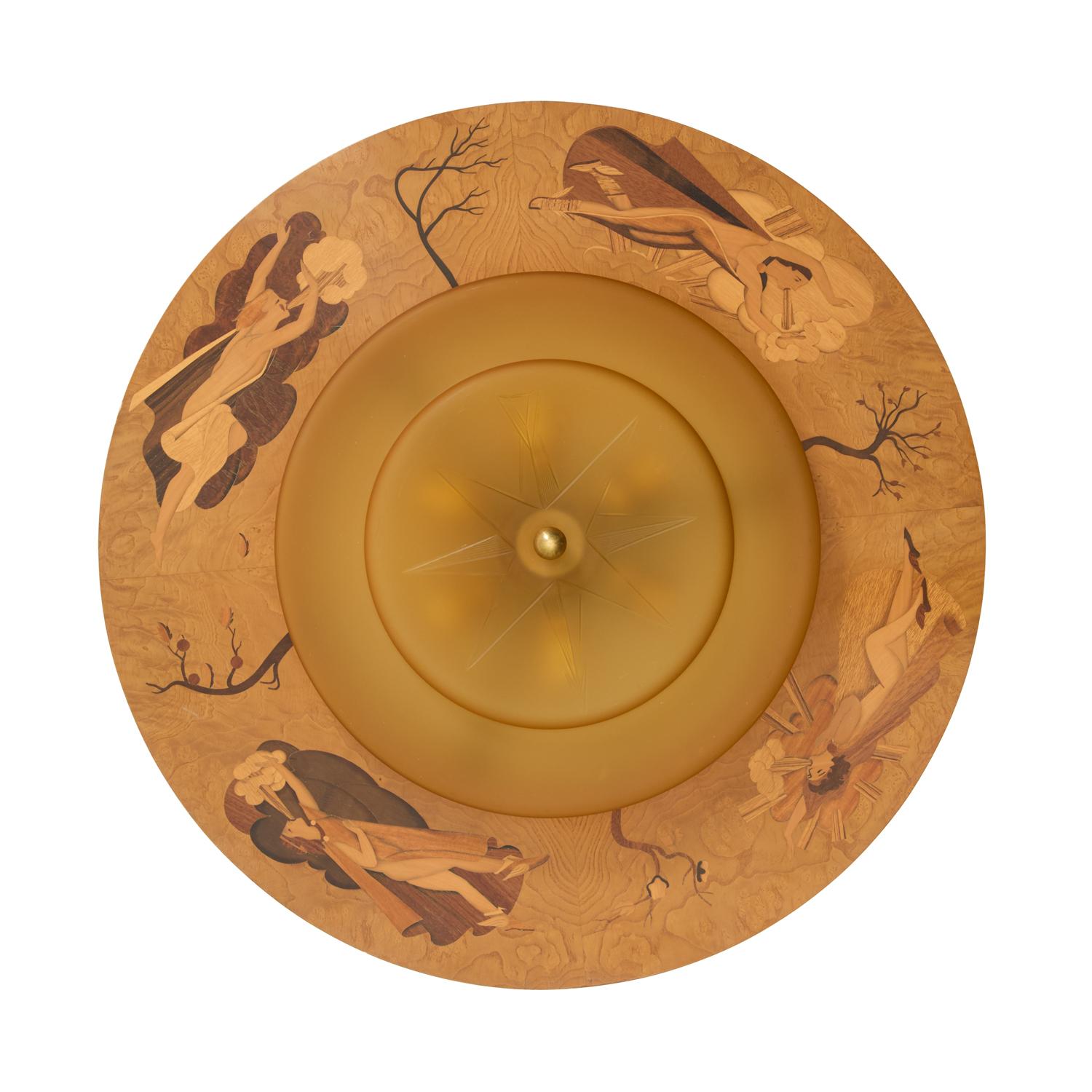 A Swedish Marquetry flush mount depicting stylized trees and figures depicting the four winds. Figures inlaid in bircha dn walnut with penwork details. The original amber colored stepped glass dome with a stylized compass motif etched on the bottom