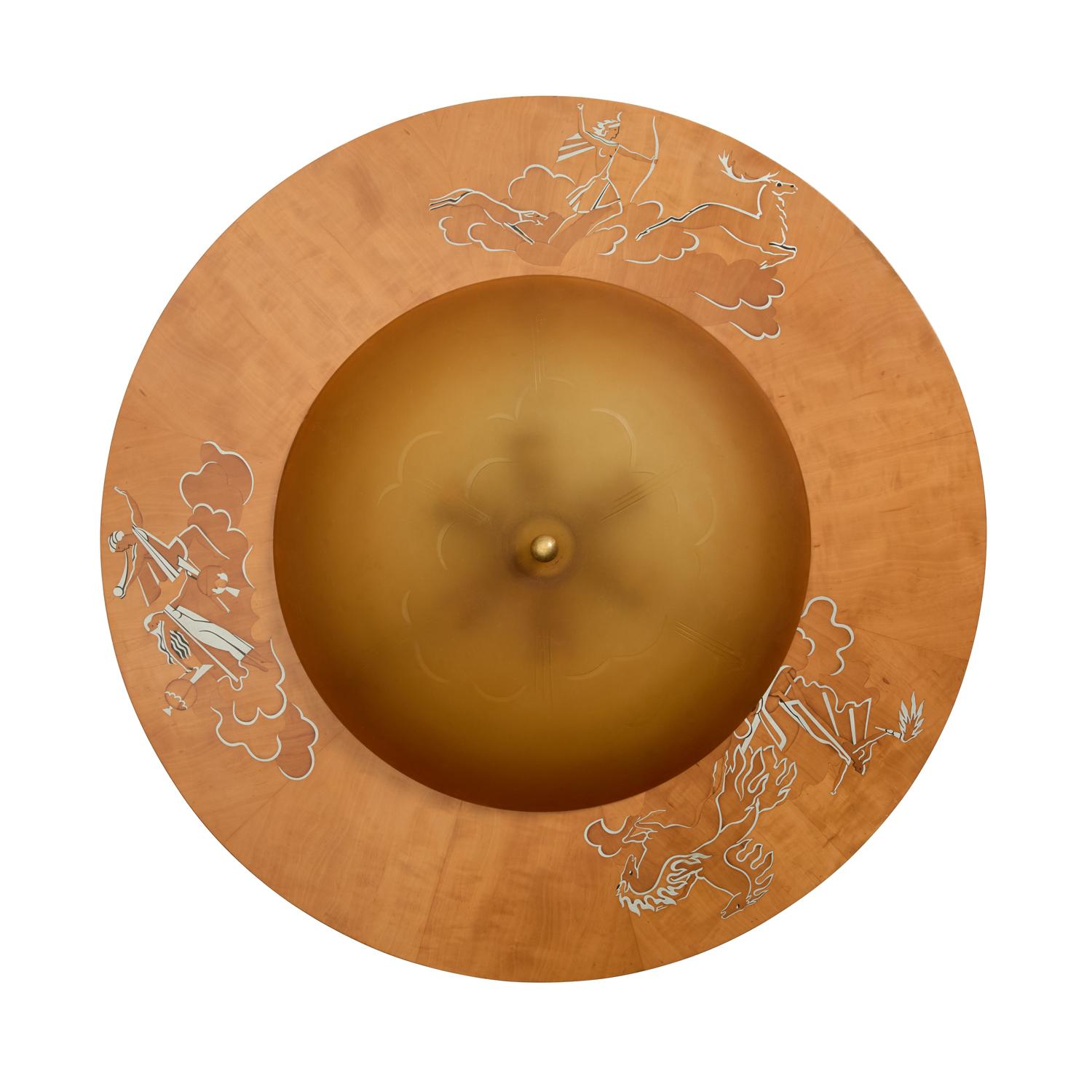 A Swedish marquetry flush mount, the wood frame having birch and walnut inlay with pewter details. Three stylized figural groups depicting the arrival of night and day, and Diana of the hunt. Original amber glass domed diffuser with stylized cloud