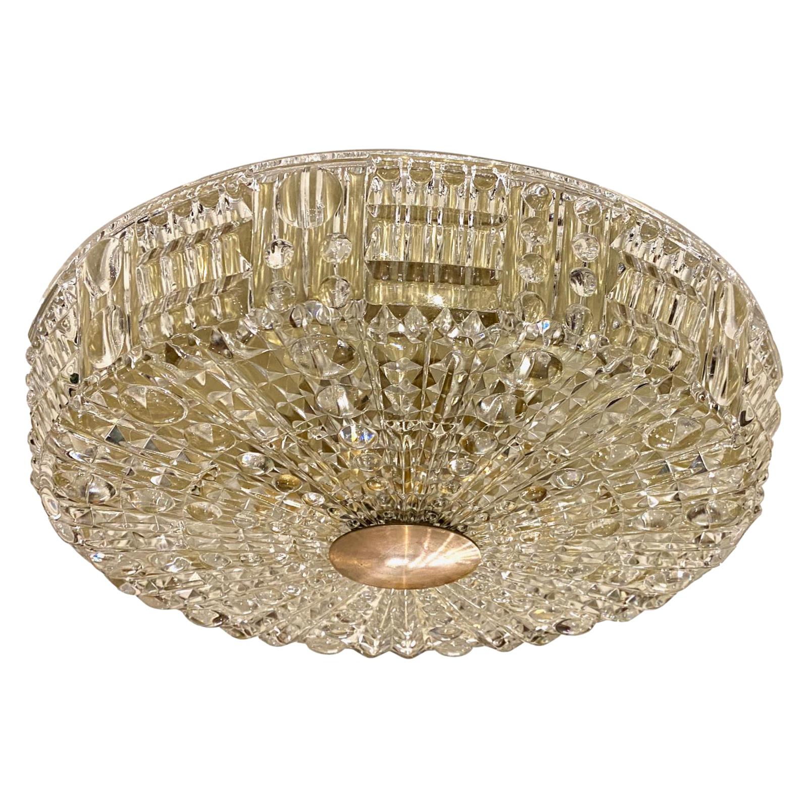 A circa 1960's Swedish molded and textured glass flush-mounted ceiling fixture with six interior lights and bronze detail.

Measurements:
Drop 3.75