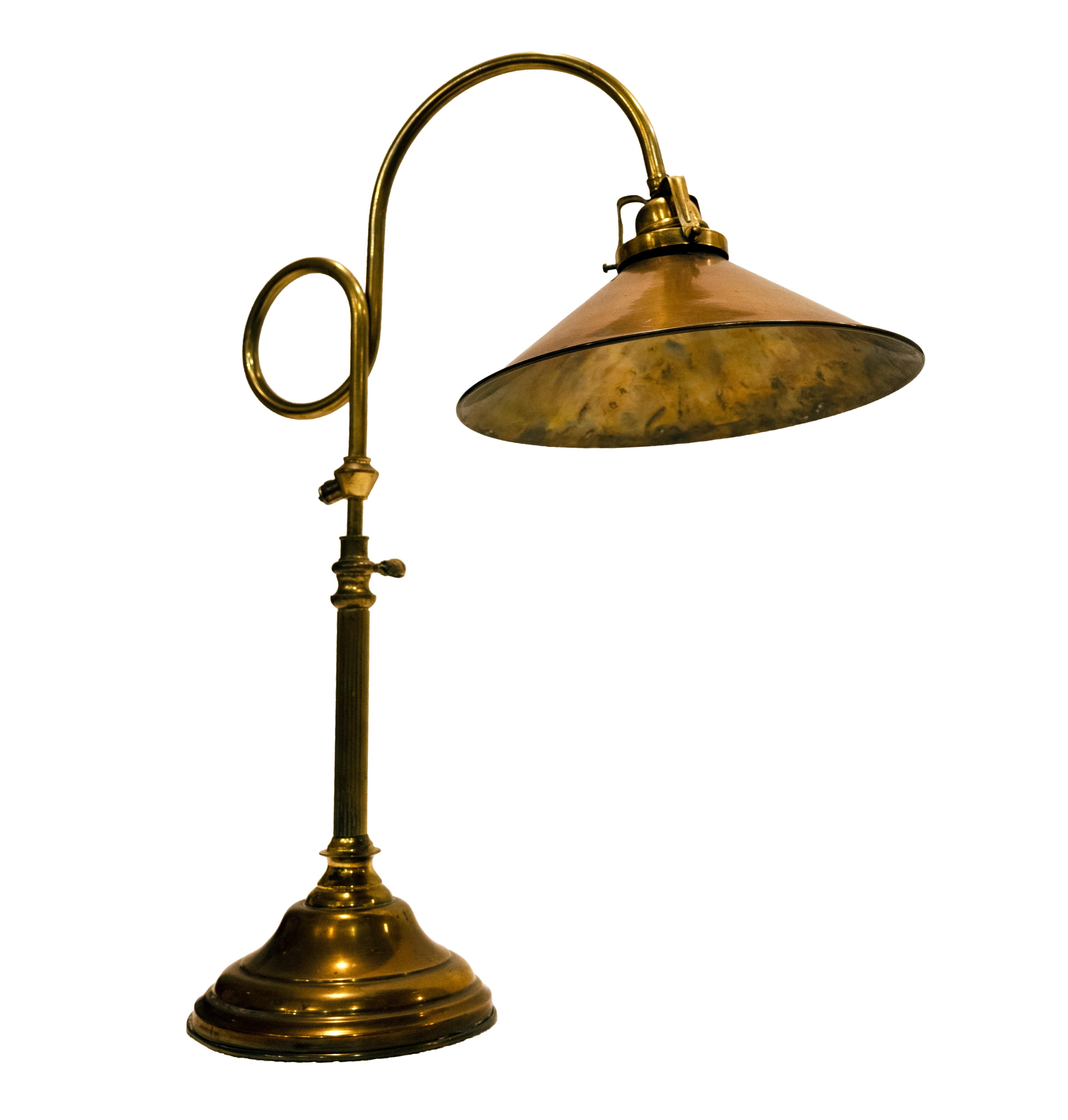 A Swedish Modern brass desk lamp with adjustable stem supporting a conical shade. Made by Stockholm-based lighting manufacturer Gamla Stans Lampverkstad. Circa 1960, price includes new wiring. 
