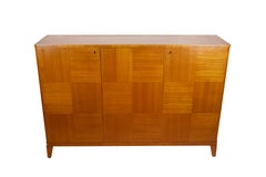A Swedish Modern Cabinet With Contrasting Veneer
