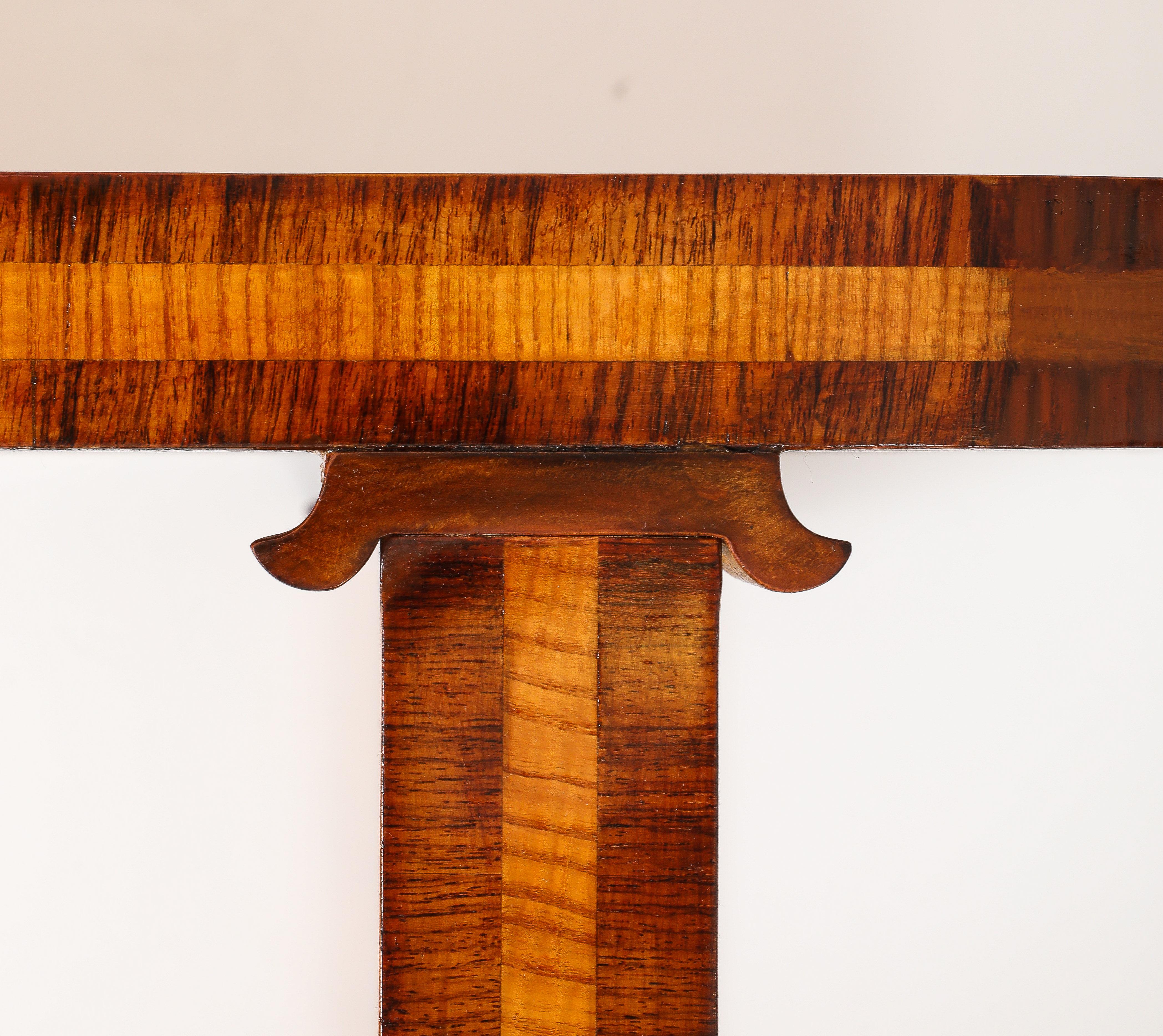 A Swedish highly figured elm root book matched veneer side table, Circa 1938, the oblong top above a conforming palisander and birch frieze raised on straight legs. Stamped and dated. 31. 10. 1938