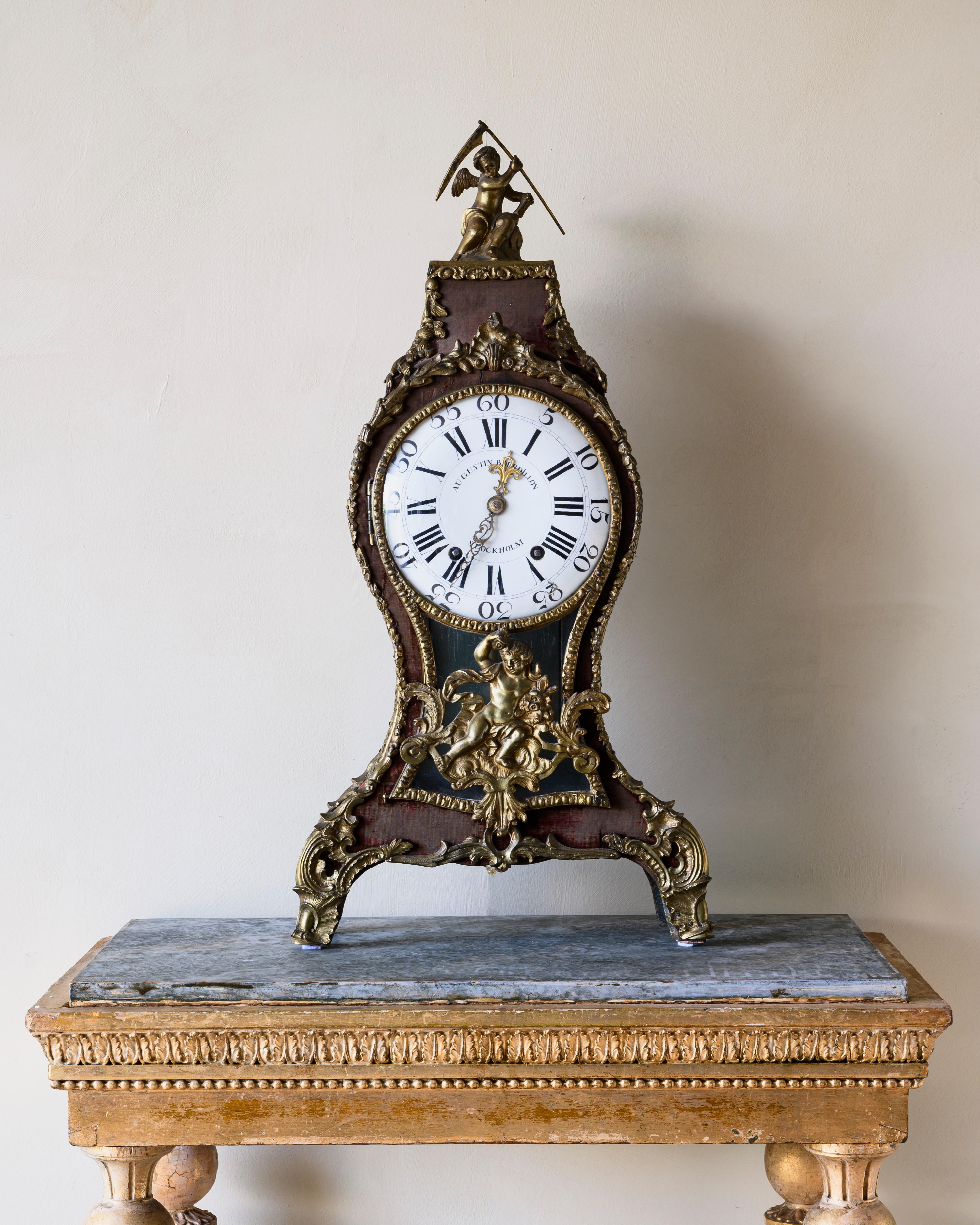 A fine Swedish 18th century rococo ringtone table clock with gilt bronze signed by Augustin Bourdillon. Covered in the original velvet with great patination. The interior of the case is painted with a chessboard pattern, Ca 1761-1770, Stockholm.