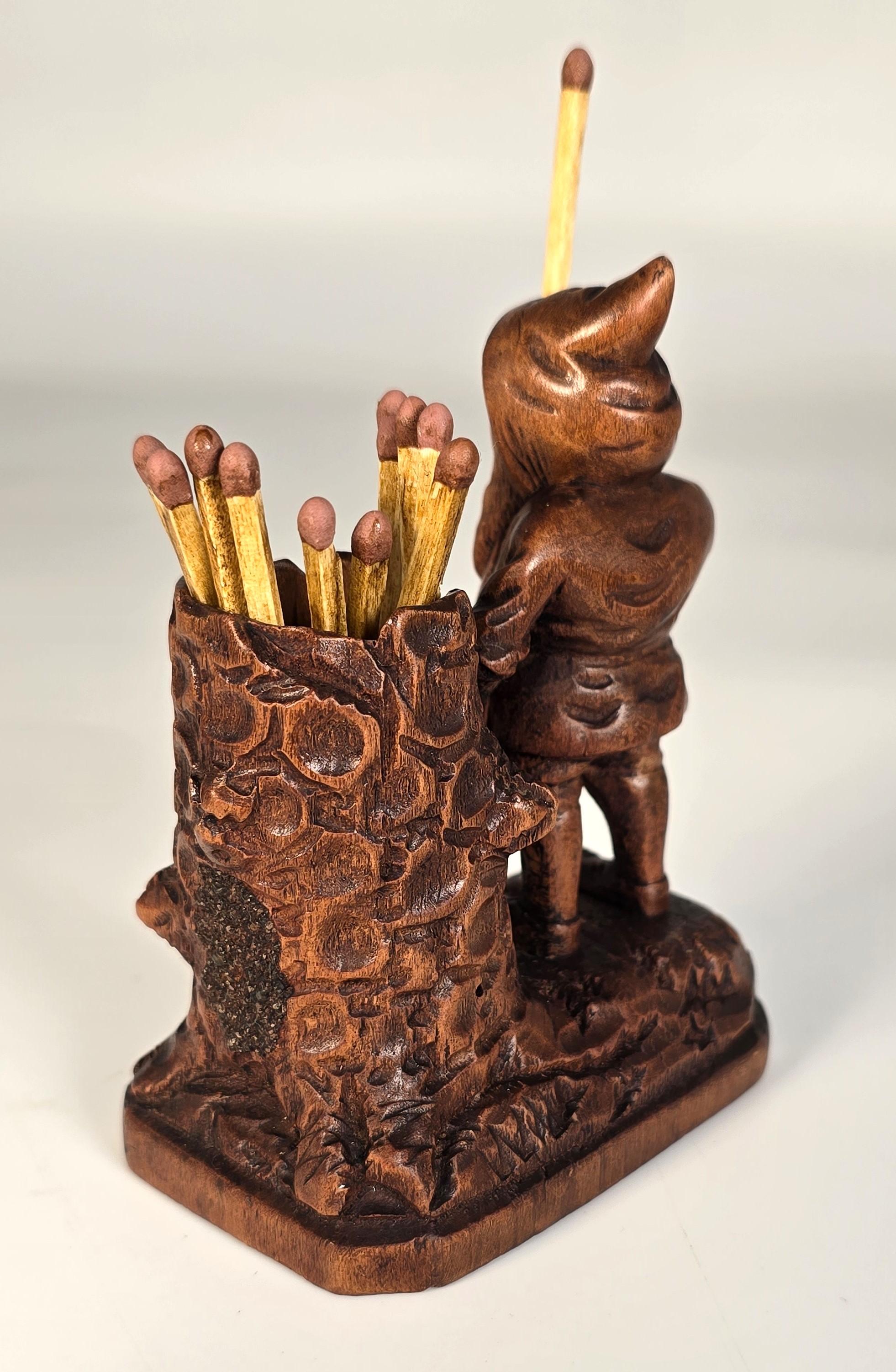 Suisse A Swiss Black Forest gnome matchstick holder/striker made in 1916 en vente