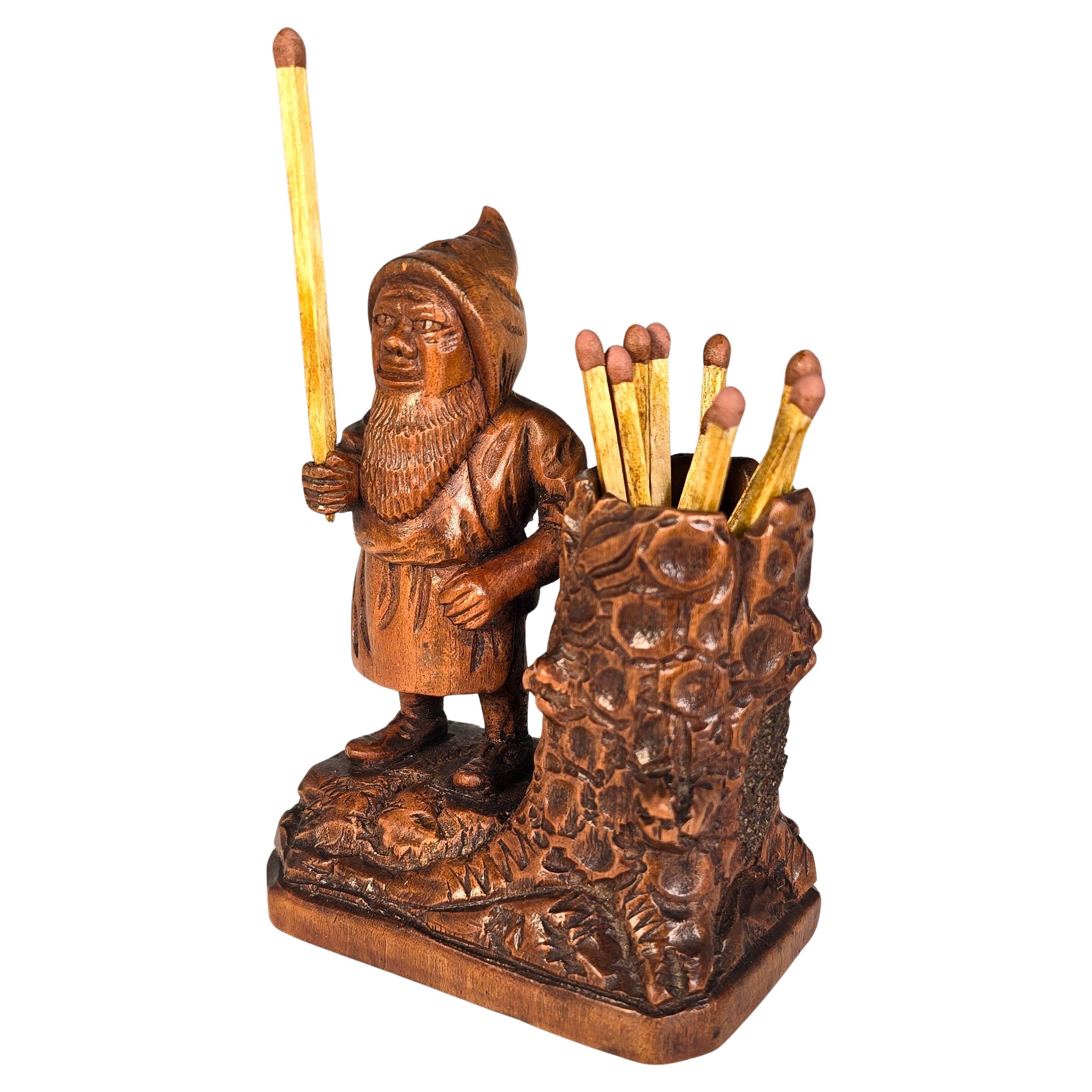 A Swiss Black Forest gnome matchstick holder/striker made in 1916