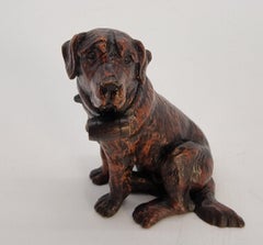 A Swiss Black Forest hand carved wood study of a St Bernard Mountain rescue dog