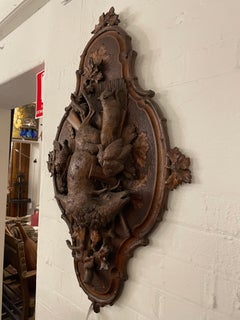 A Swiss Carved Black Forest Hunting Wall Plaque, Early 20th Century