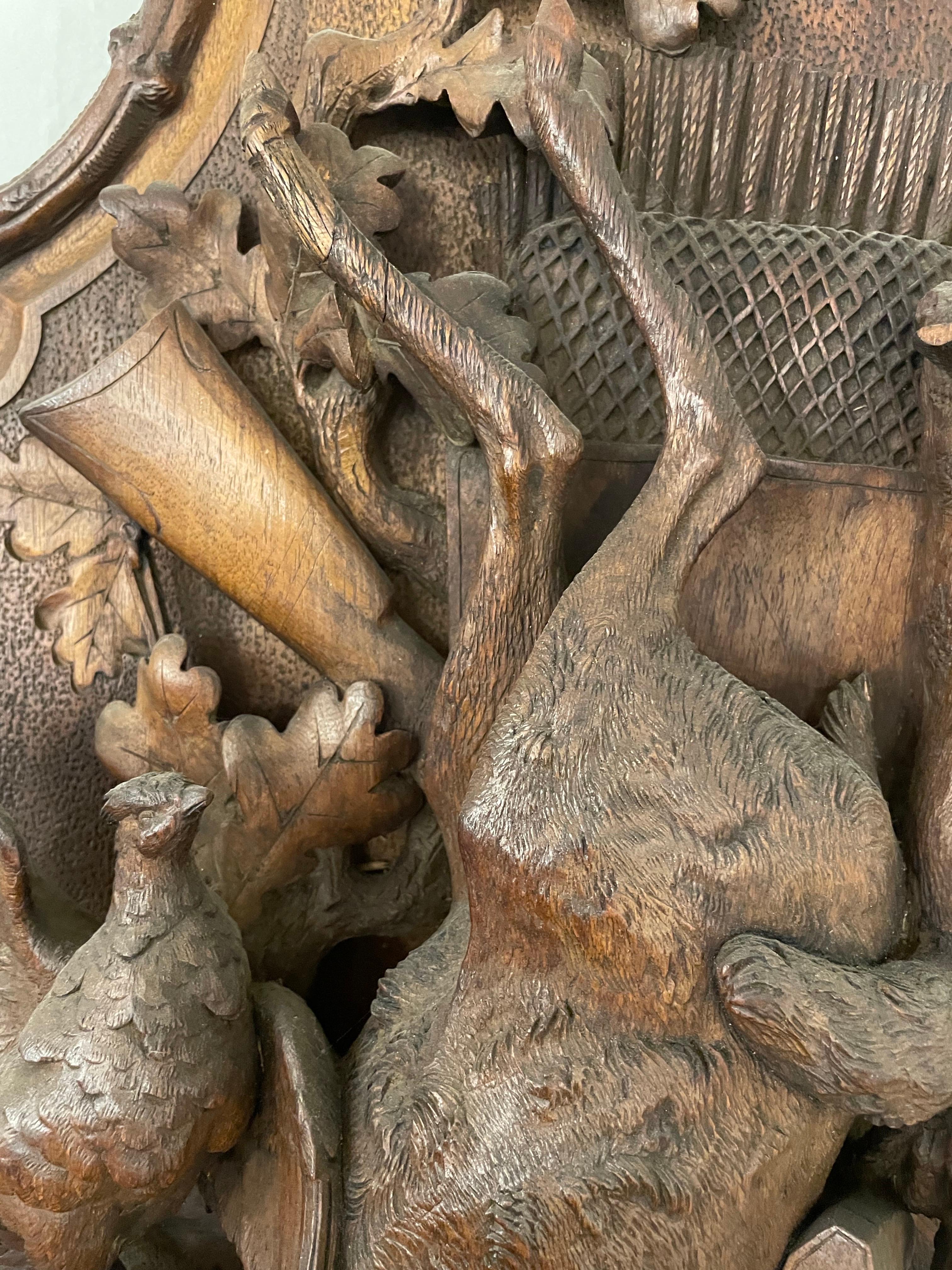 A Swiss Carved Black Forest Hunting Wall Plaque, Early 20th Century For Sale 1