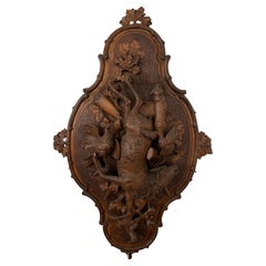 A Swiss Carved Black Forest Hunting Wall Plaque, Early 20th Century