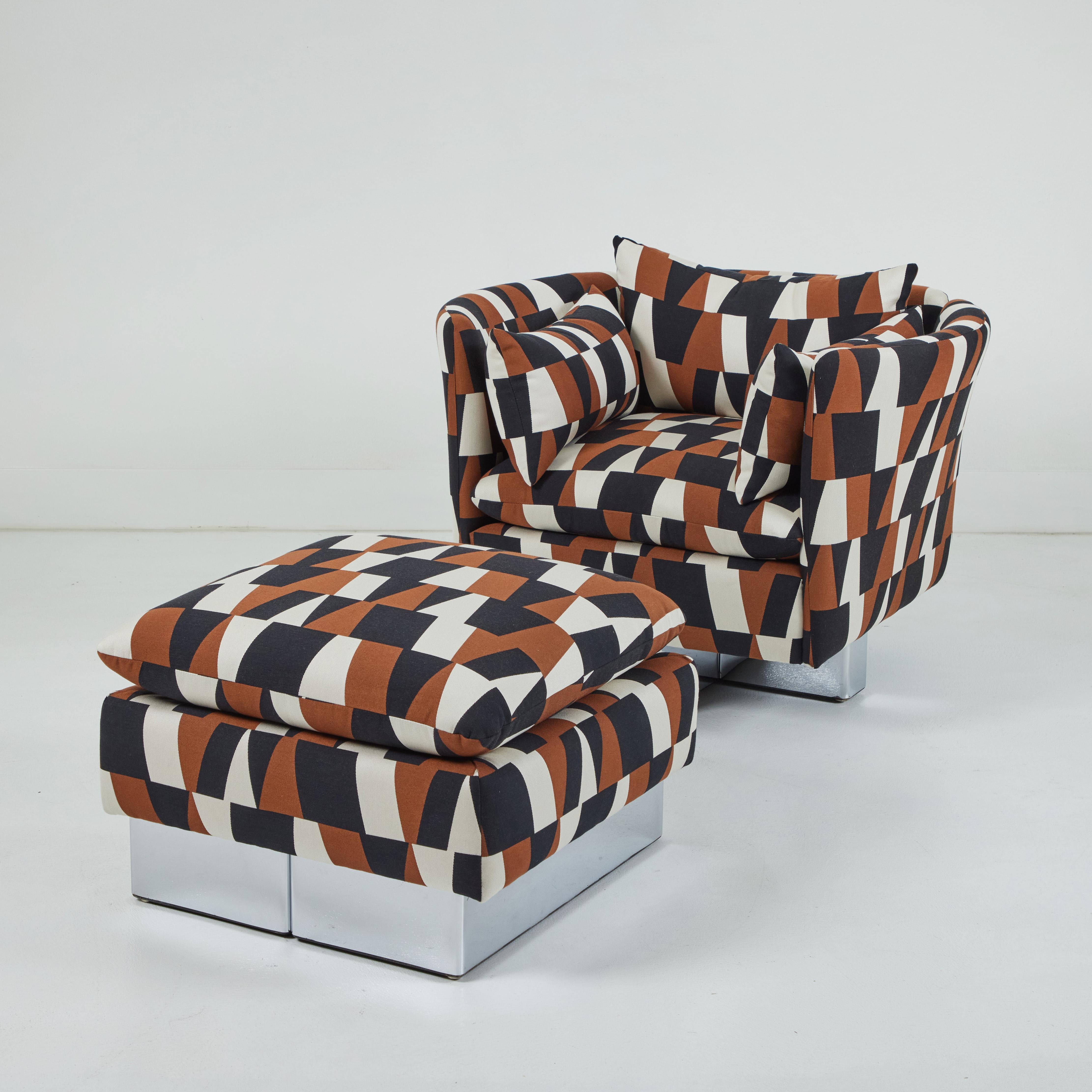 This chair and matching ottoman exemplifies the groovy laid back style of 1970s decoration.  The chair which sits on a polished chrome cruciform base is accented by 3 loose cushions, on at either side and a back cushion.  the ottoman features a