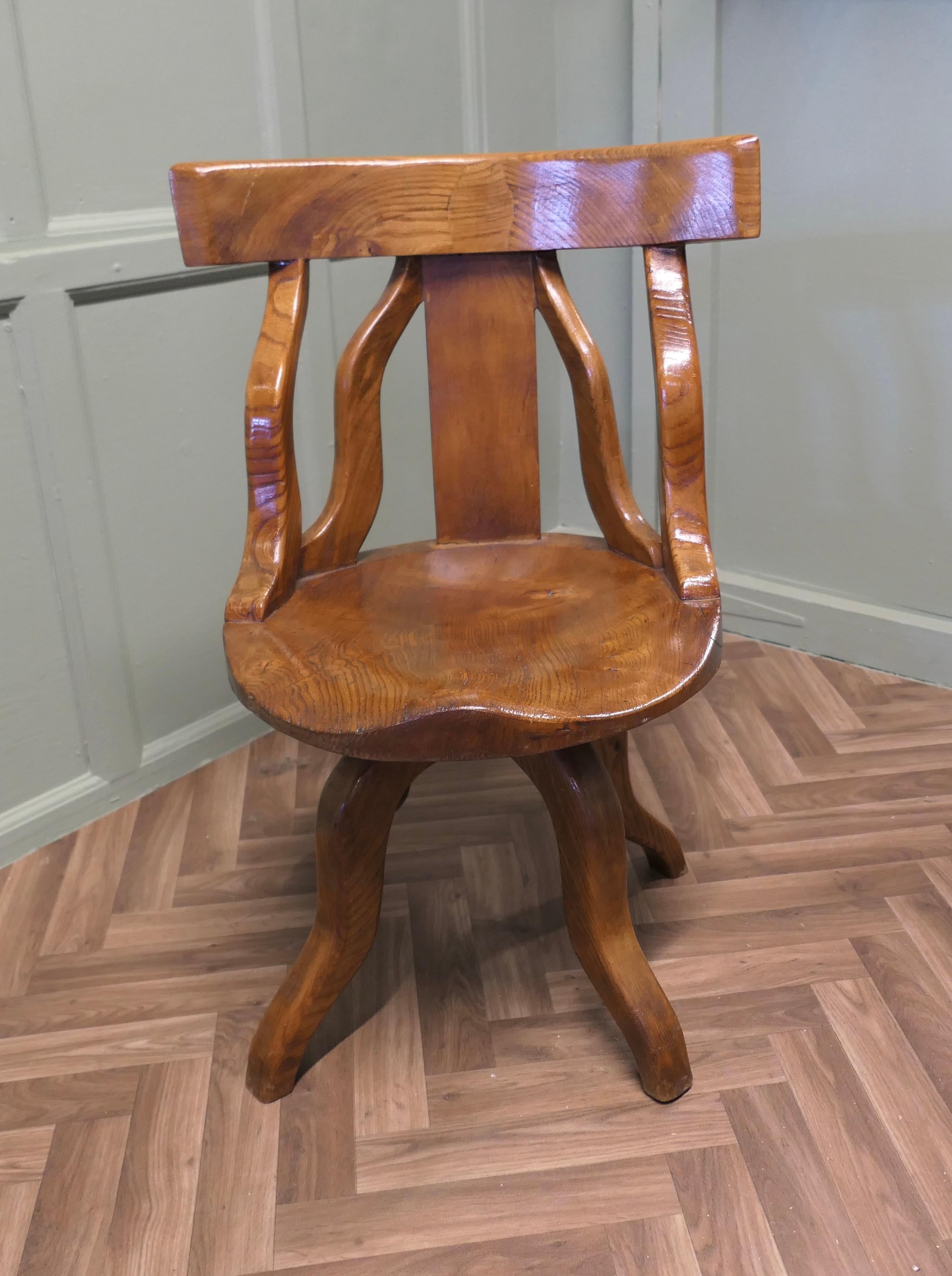 A Swivelling Elm Office Chair or Desk Chair 

The Chair is unmistakably a country piece, made in the 1960s by a skilled traditional craftsman to his own unique design. The chair has an attractive curving back top rail in the style of a captains