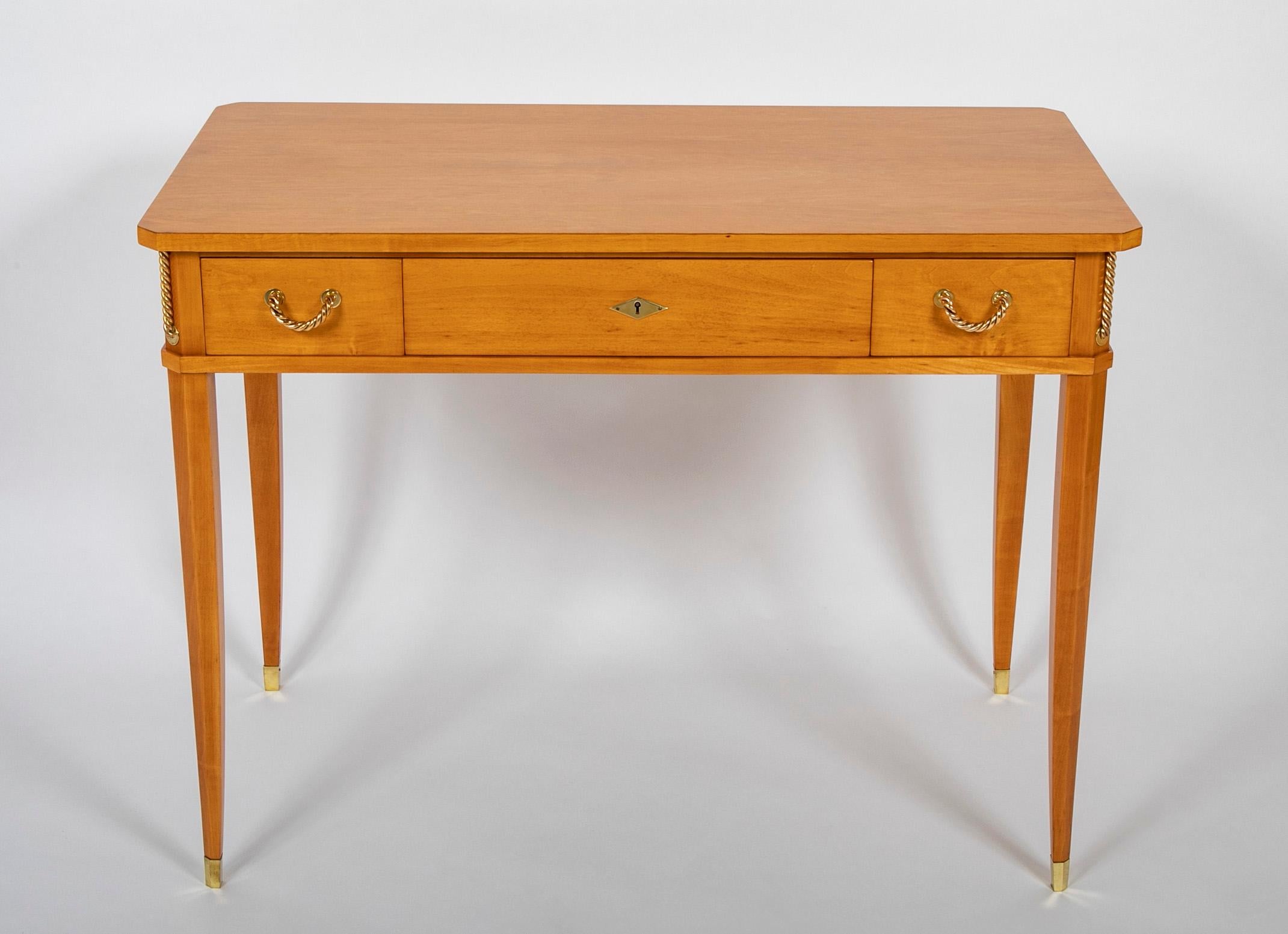 This striking desk is part of a large group of Sycamore furniture designed by Raphael and feature in the 1939 Salon Des Arts Mengers. This show was seen as solidifying Raphaels place with the contemporary luxury interior design market. The follow