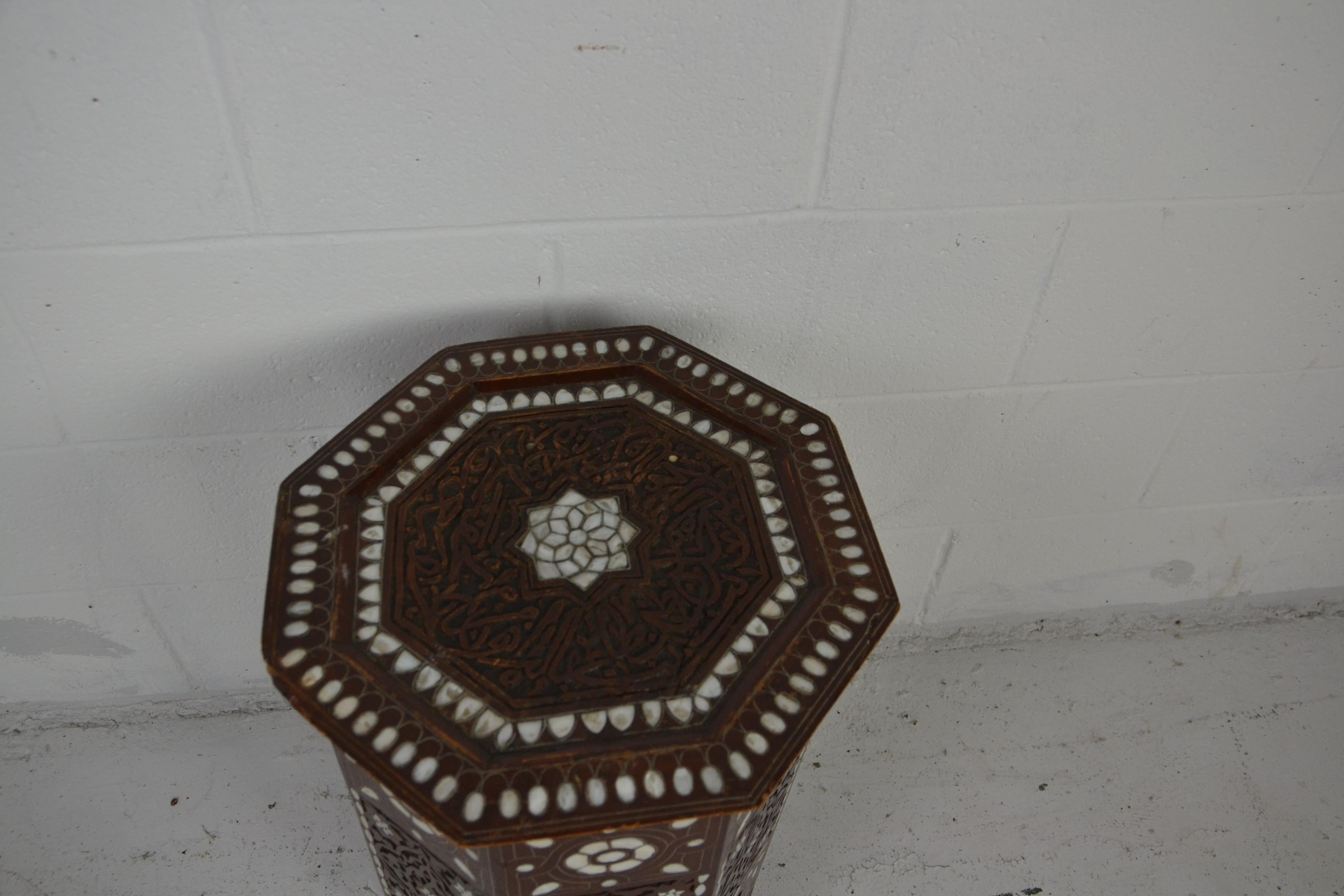 A Syrian end / side table profusely inlaid with mother of pearl. Hand carved hardwood.