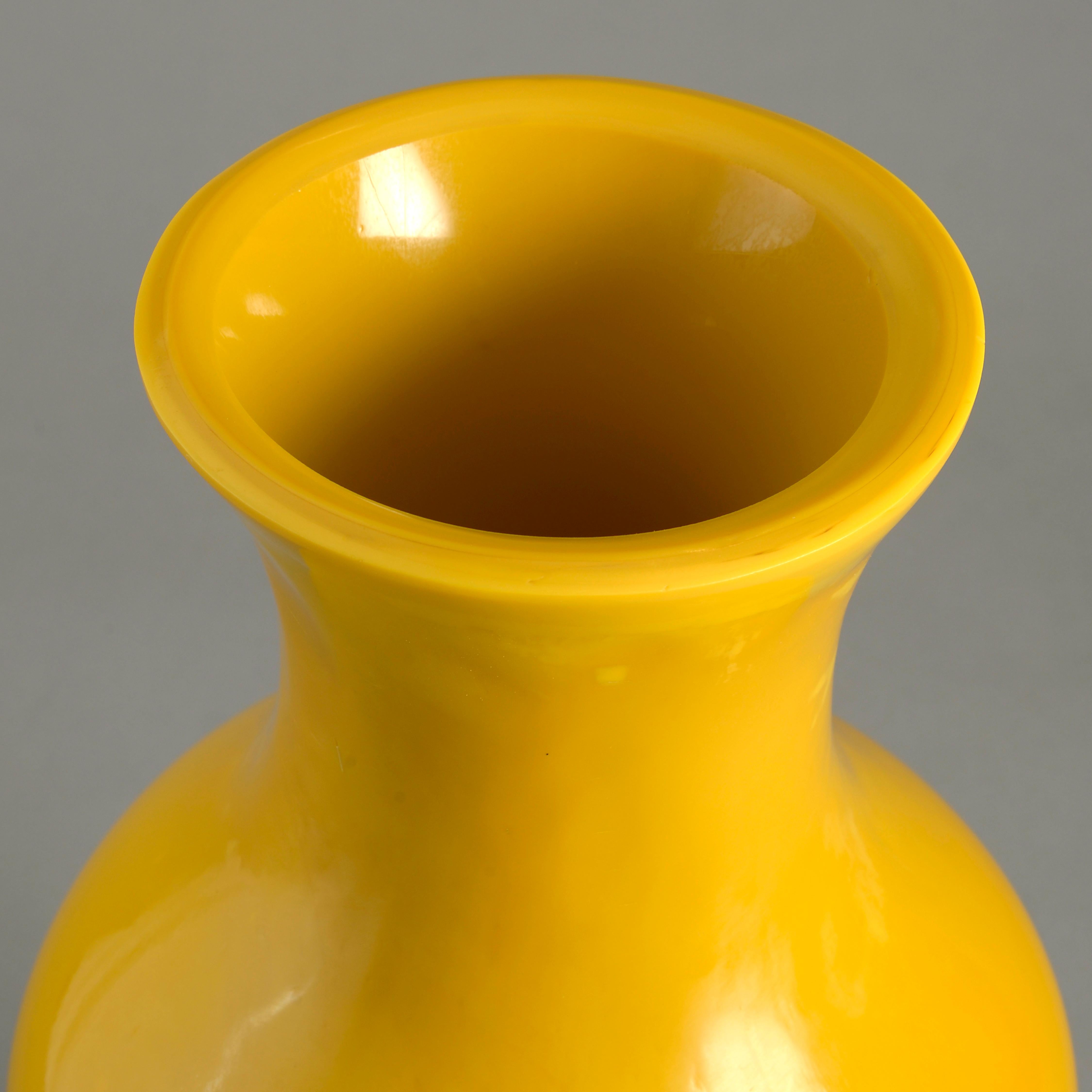 A fine late 19th century yellow Peking glass baluster form vase of good color and scale.
  