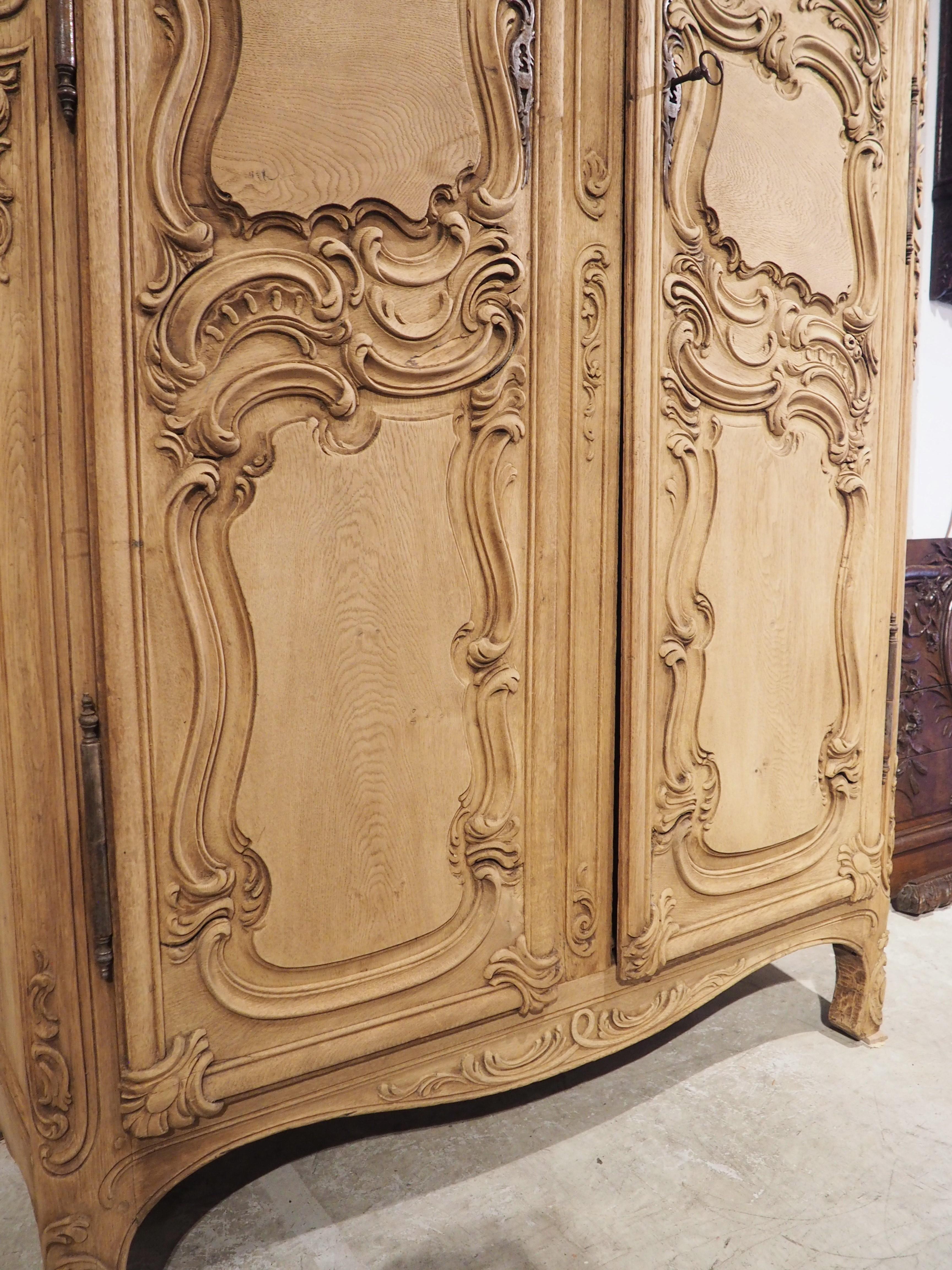 Tall and Narrow Early 1800s Bleached French Armoire in Carved and Pegged Oak 4